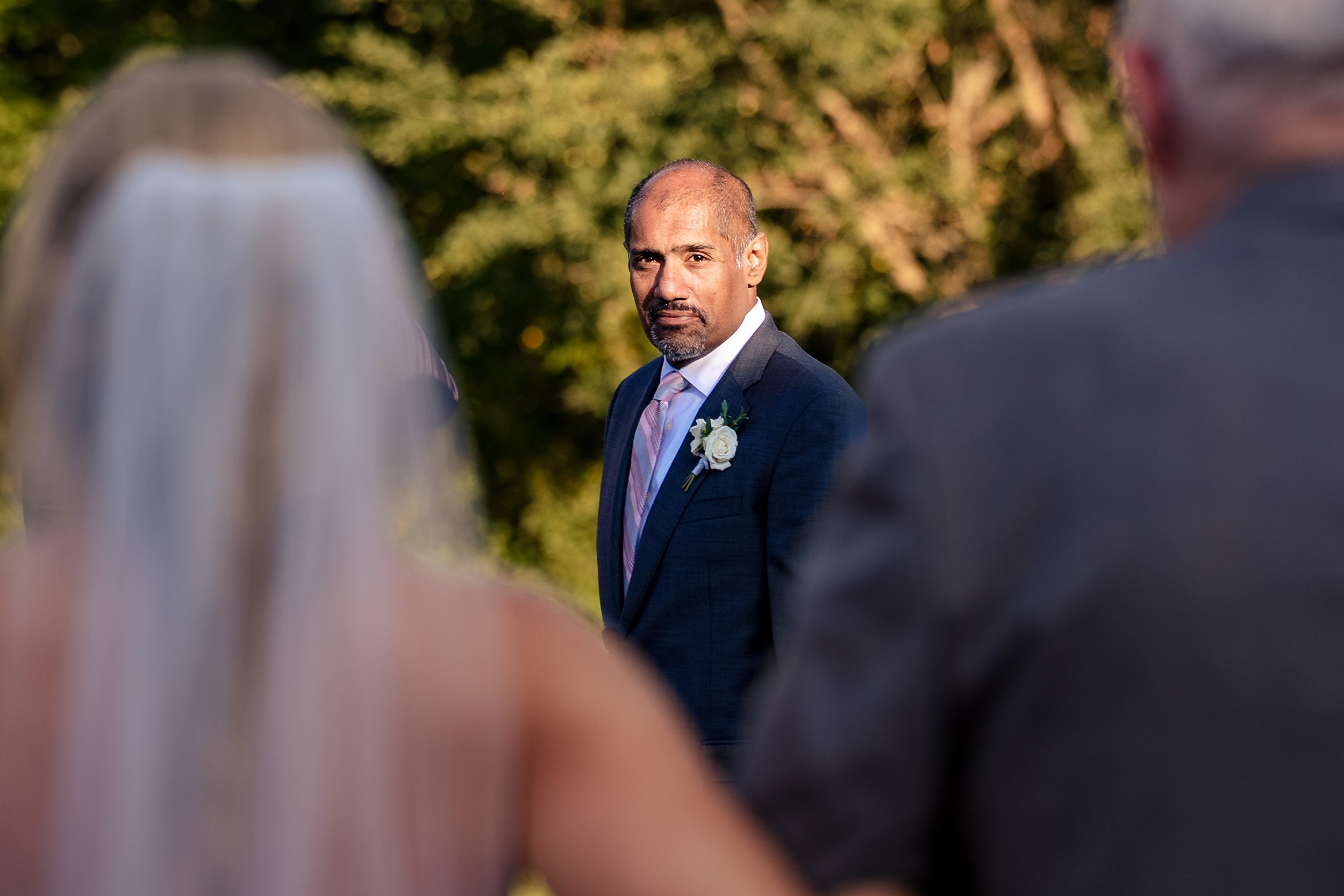 groom seeing the bride come down the aisle
