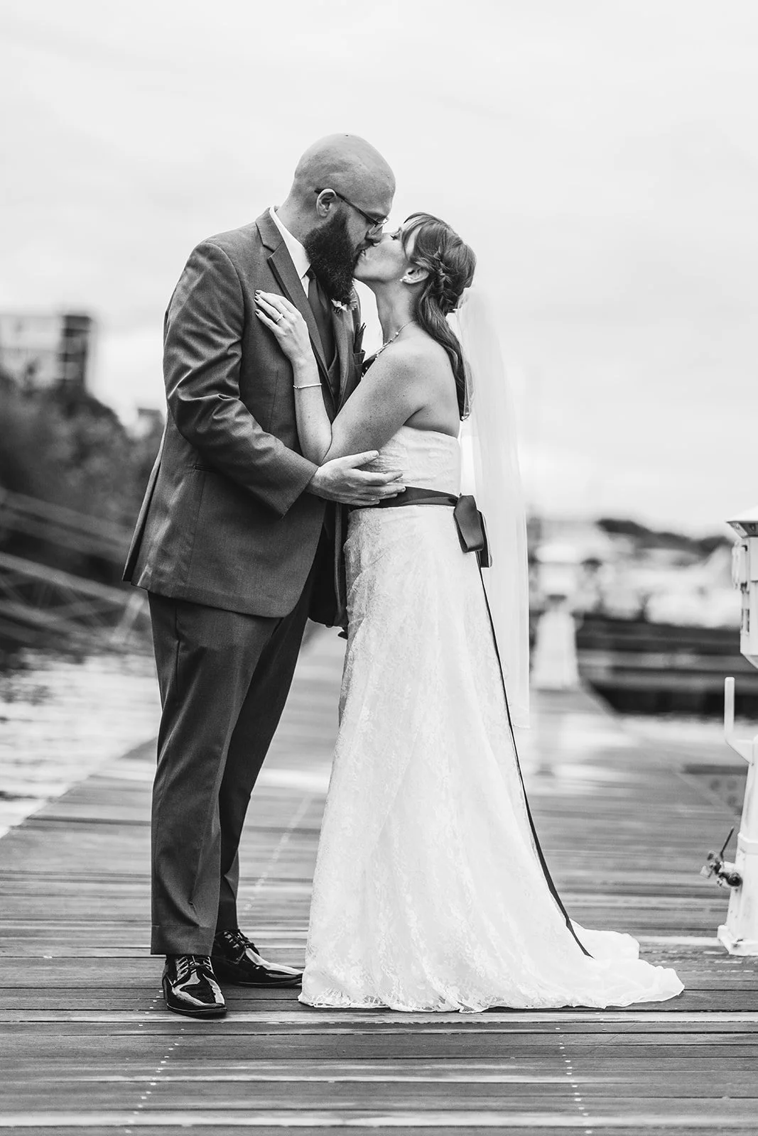 bride and groom kissing during portrait session