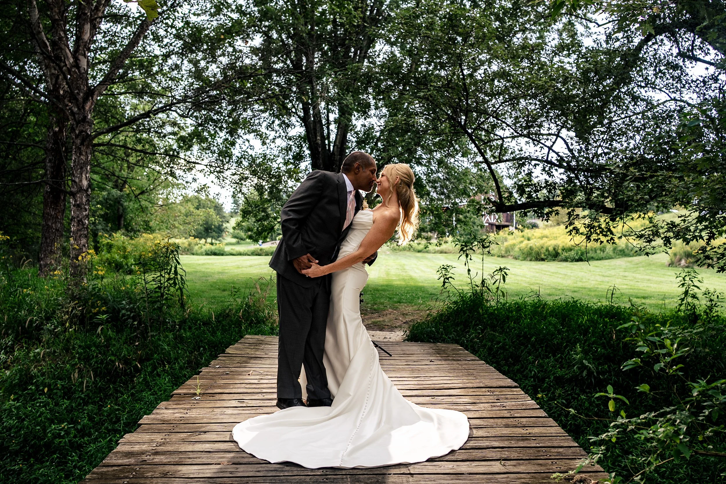 bride and groom portrait on bridge
