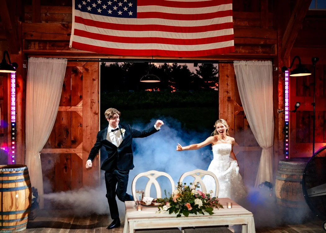 Fiona and Cole celebrating together during their Northern Virginia wedding reception.`
