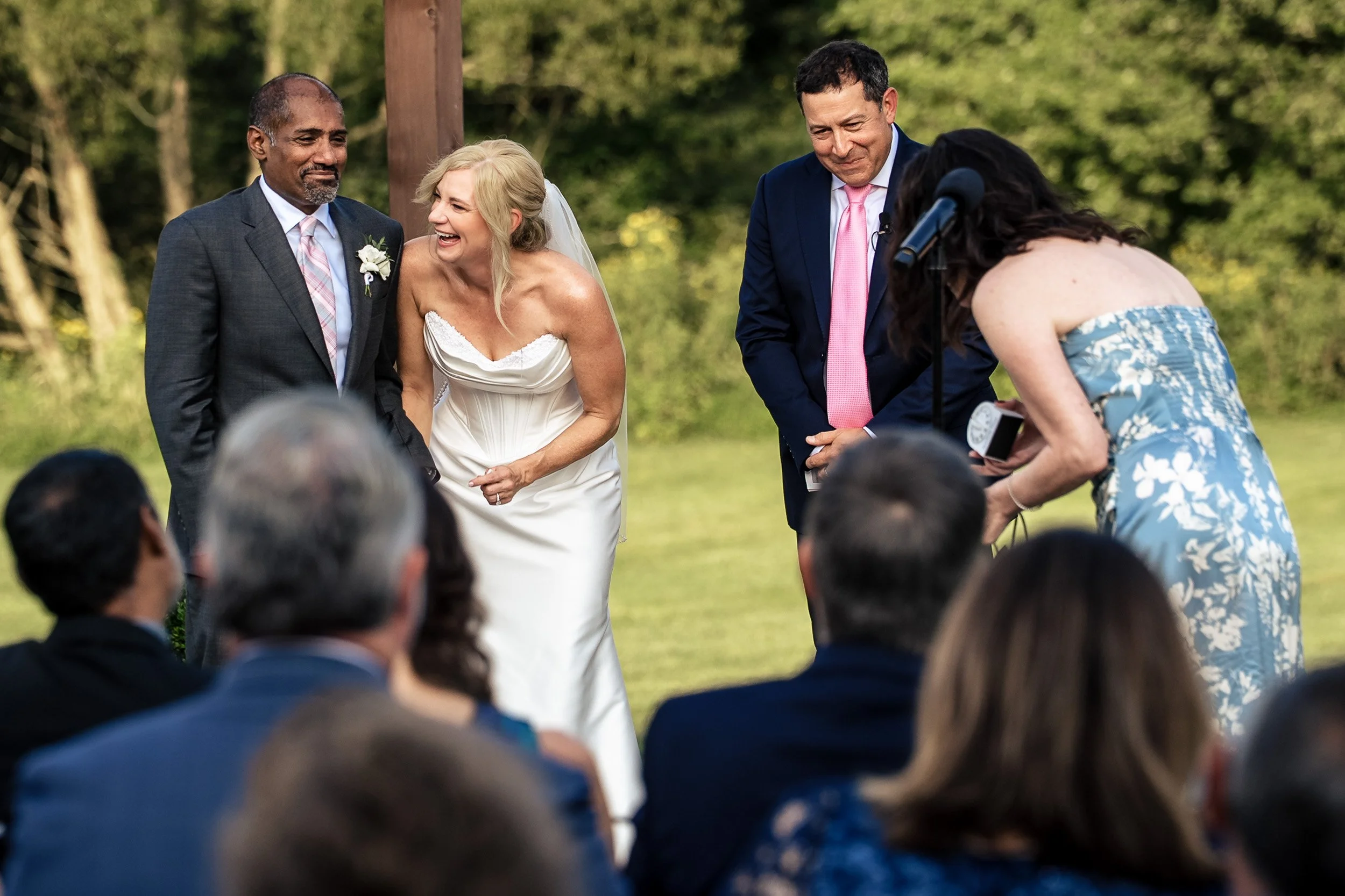bride and groom laughing at their friends story