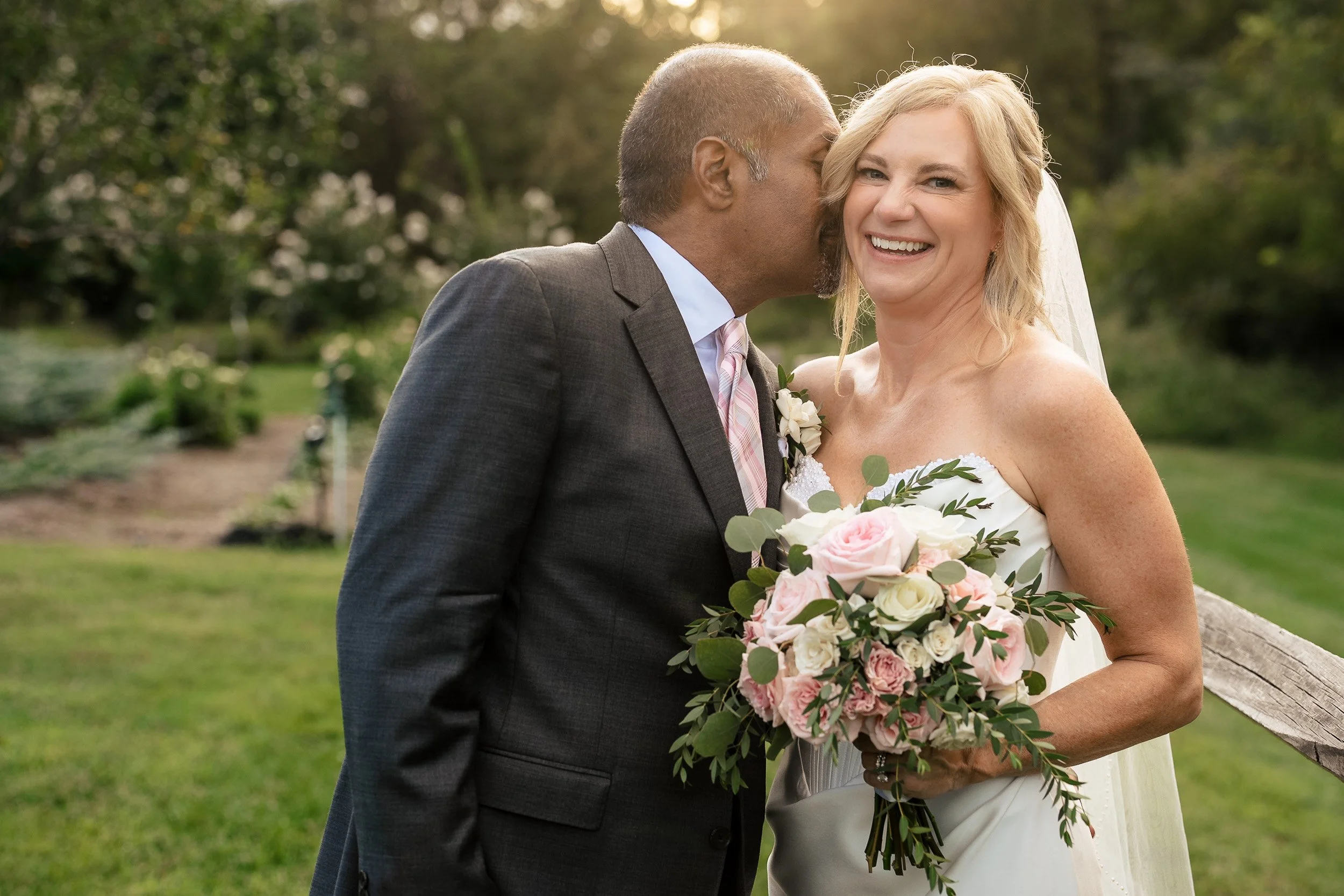 bride and groom portrait in sunlit background