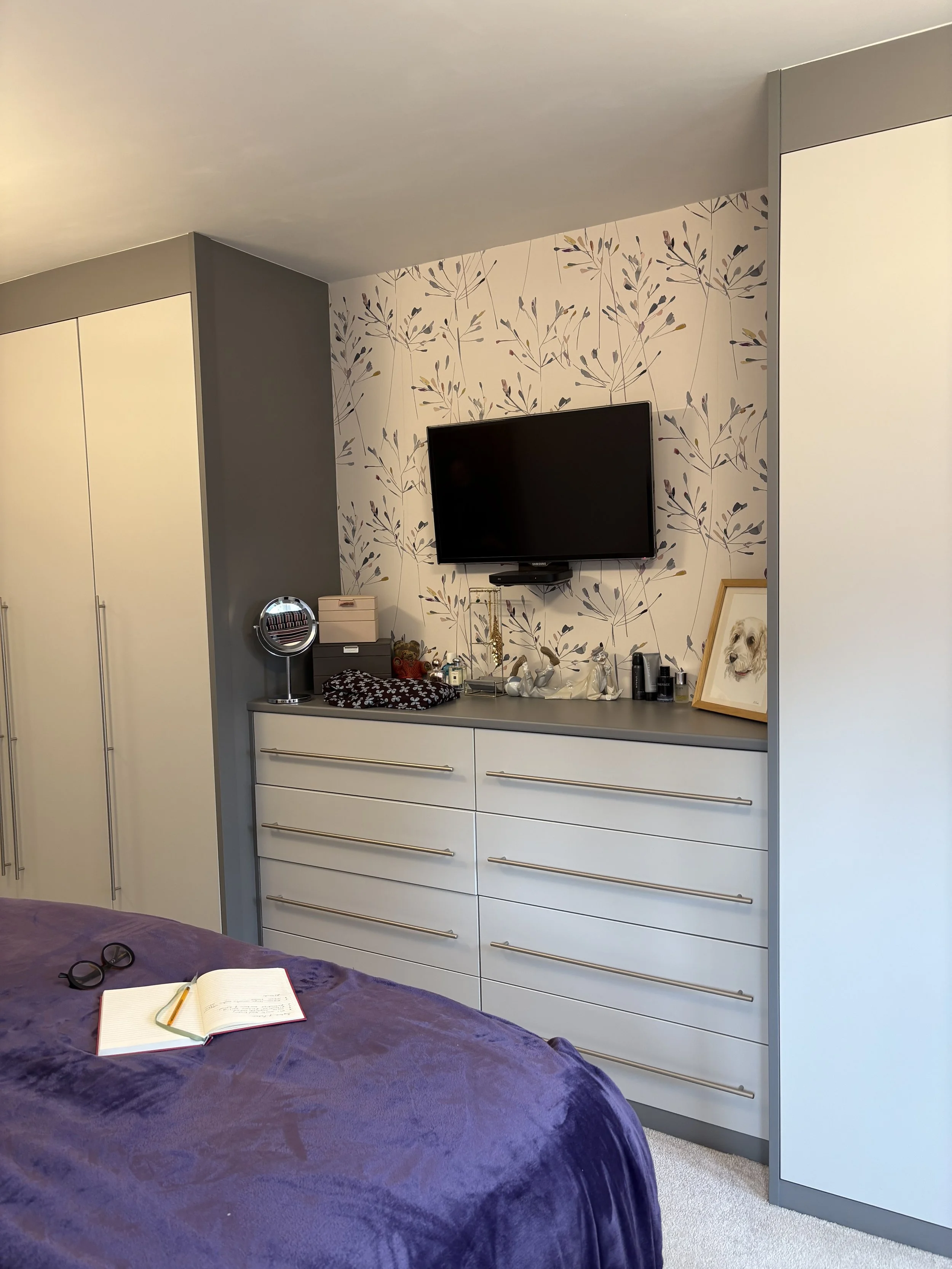 Before: dark grey fitted wardrobes and drawers giving heavy feel to primary bedroom, East Bridgford