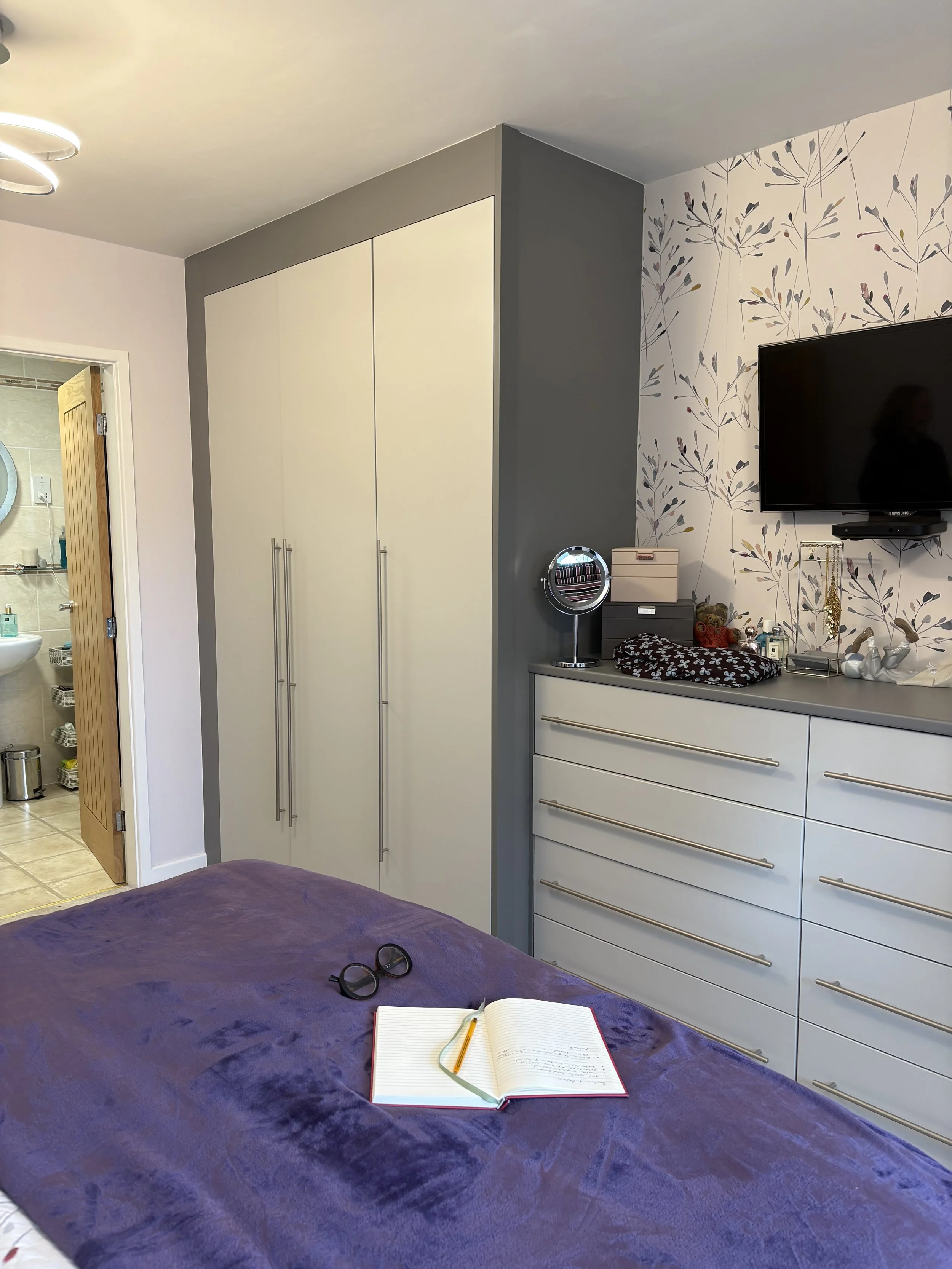 Before: primary bedroom with dark grey fitted wardrobes and heavy blocky shape, East Bridgford Nottinghamshire
