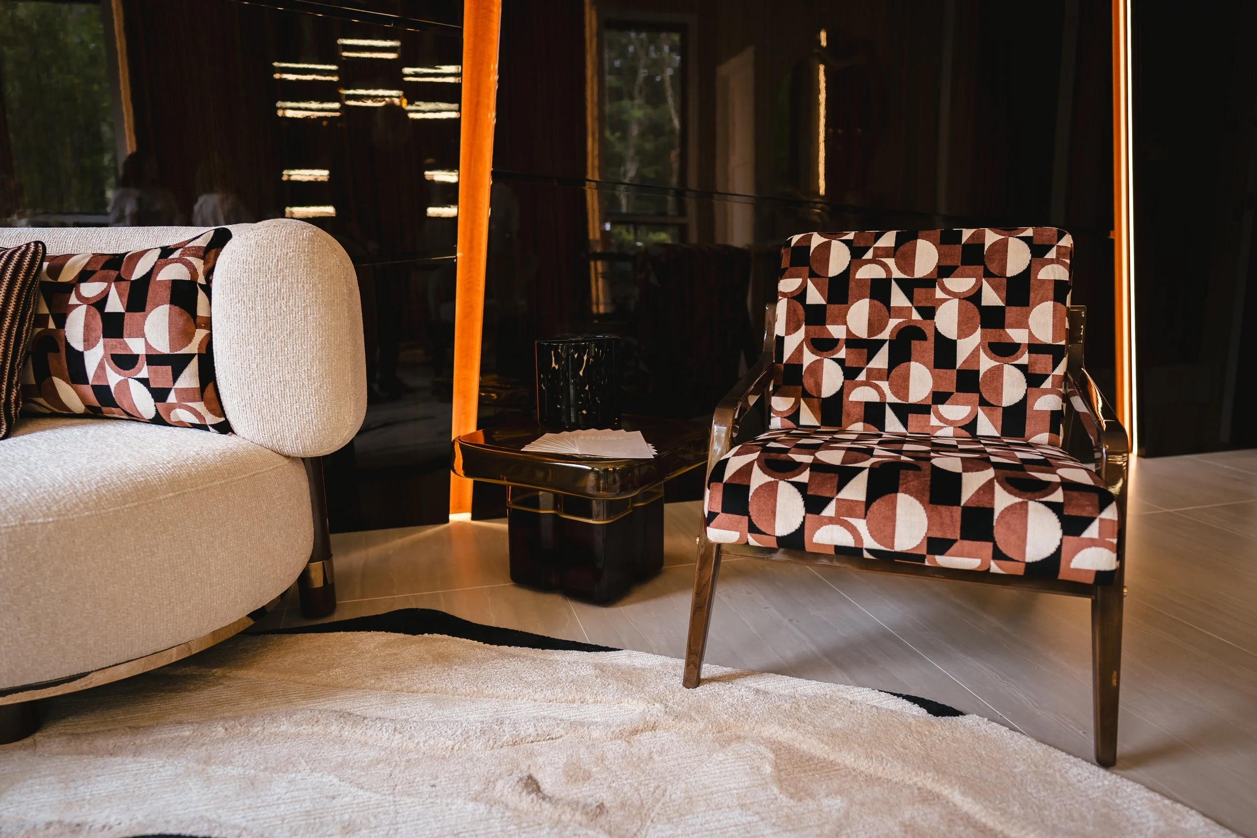 Luxury furniture Ticol Armchair Elegant upholstered armchair featuring a solid wood structure and sculptural silhouette.