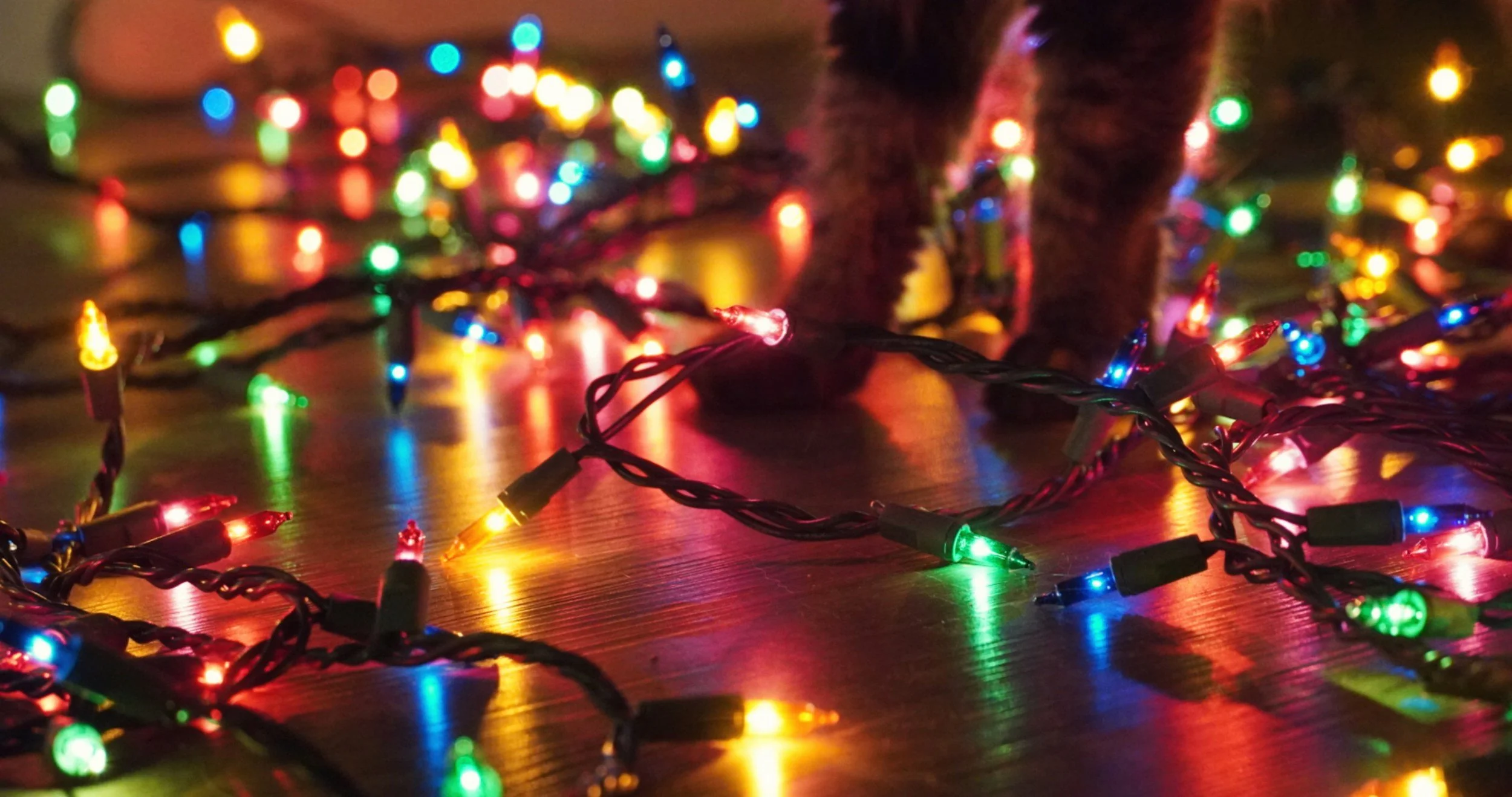 Holiday lights scattered on the floor, representing sensory overload and holiday pressure