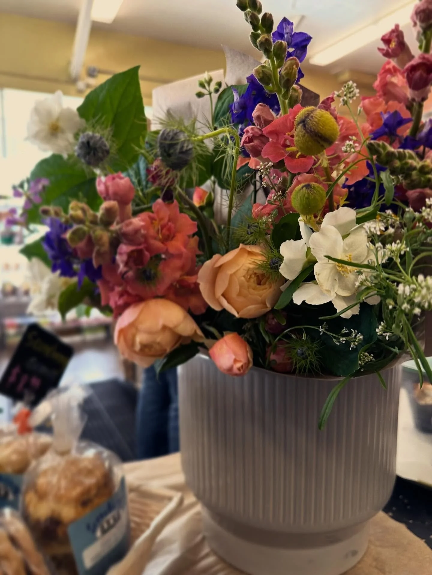 Christina and Catherine braved the rain to restock bouquets @estudilloproduce 💐🌦️ if you need a bright spot in all the drearies, grab some blooms!