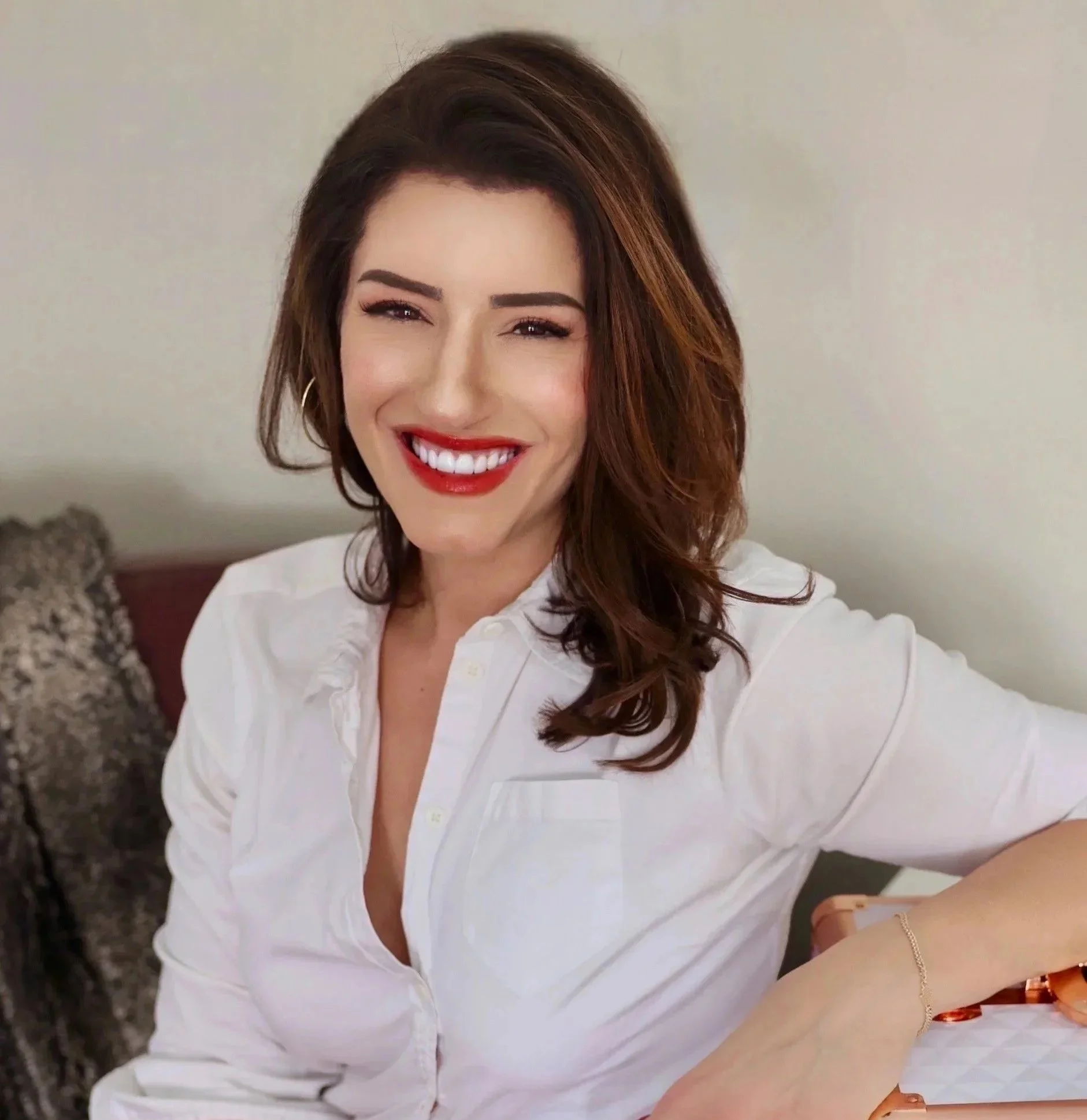 Portrait representing the welcoming face behind RC Organize & Design in a calm, styled interior