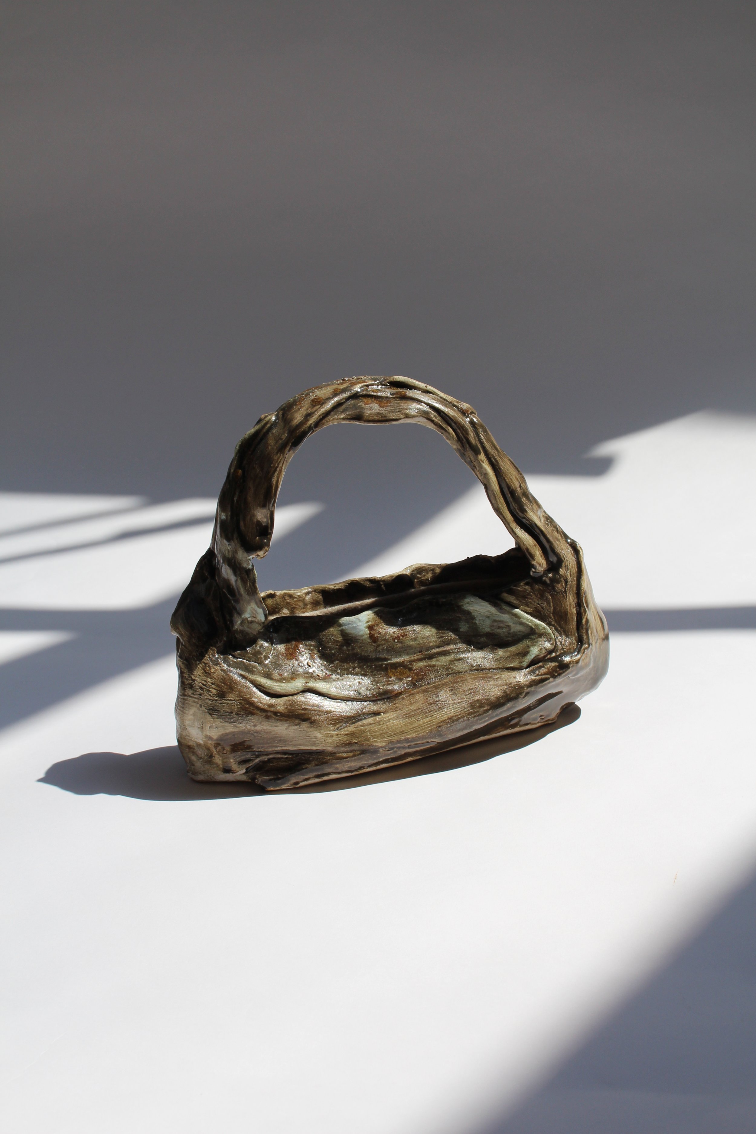 "Loomed and Lost 2" 2025, 10 x 8 x 4, stoneware, underglaze, studio waste, wool felt