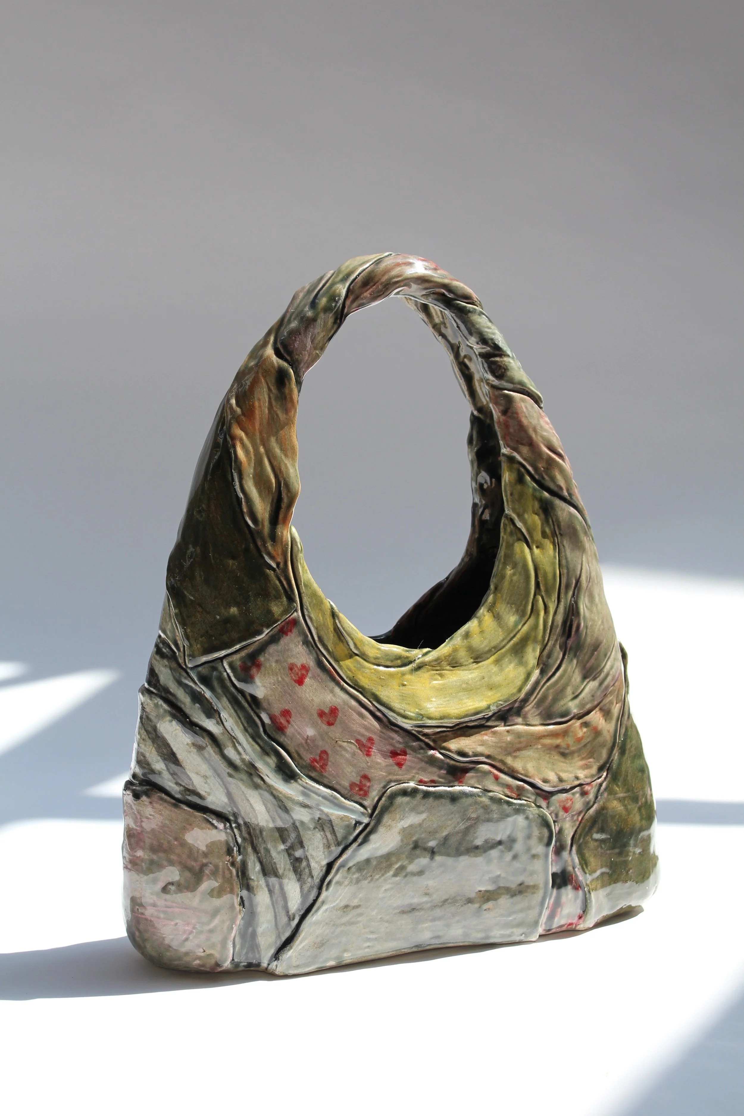 "Loomed and Lost" 2025, 13 x 11 x 3, stoneware, underglaze, studio waste, wool felt