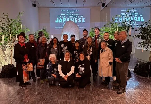 A group of people attend the opening of the Wakasa Spirit Stone exhibit at the San Francisco Asian Art Museum.