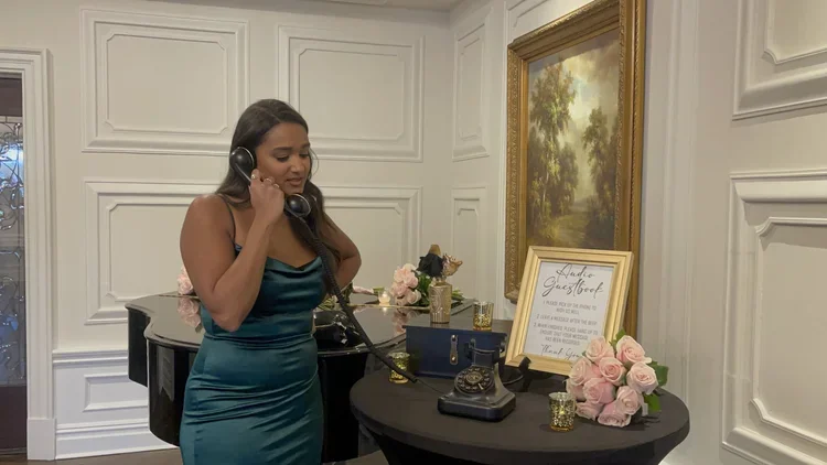 Unique audio guest book setup with vintage-inspired telephone, allowing guests to leave heartfelt messages.