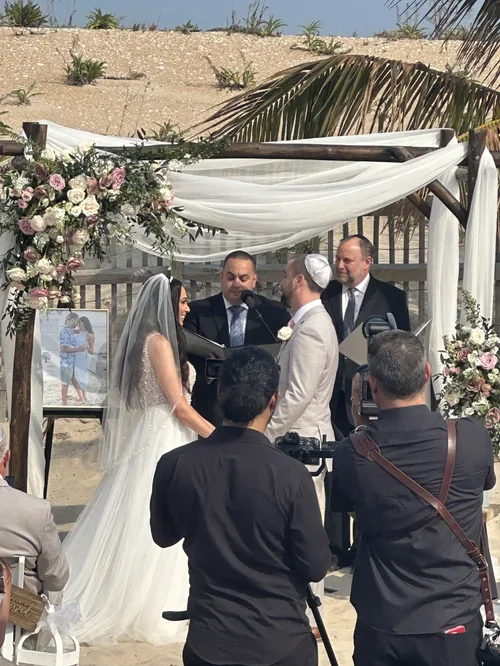 Beautiful wedding ceremony with elegant decor, a romantic altar, and guests seated in a scenic outdoor or indoor setting