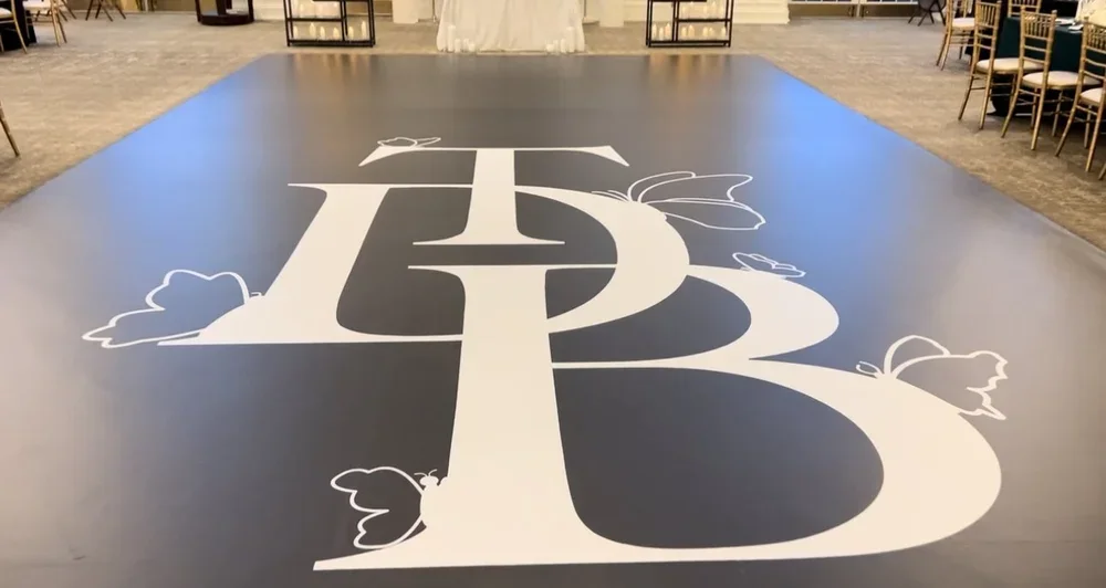 Elegant custom dance floor wraps featuring personalized designs to match any wedding or event theme.