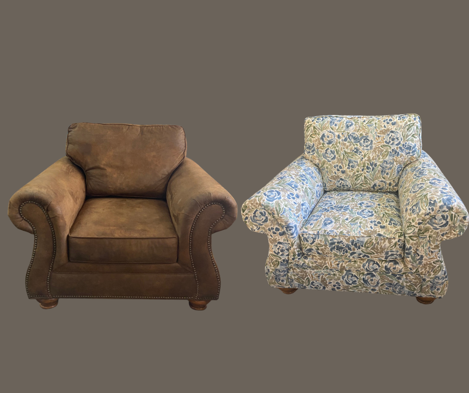Two armchairs, one brown leather with nailhead trim, and one floral upholstered with blue, green, and beige patterns, placed against a plain gray background.