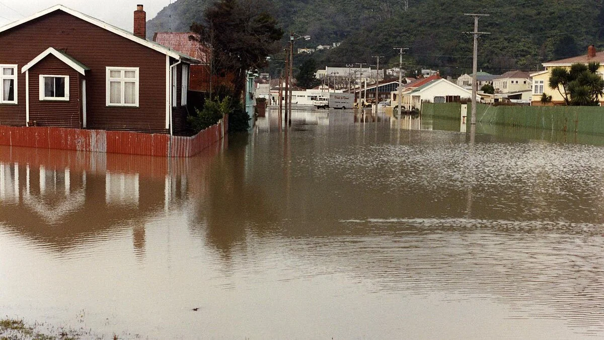 A flooded road and houses.