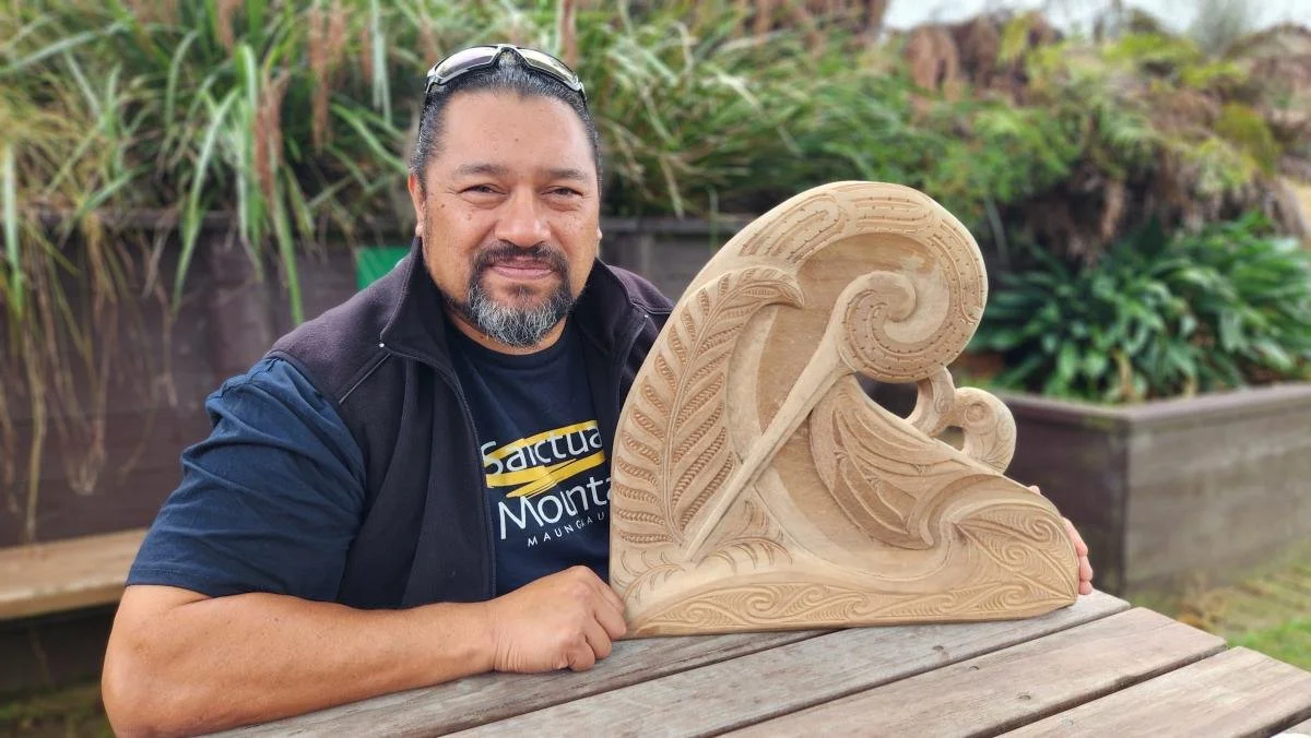 Bodie Tihoi Taylor, the Cultural Advocate at Sanctuary Mountain Maungatautari, with a kiwi carving he is working on.