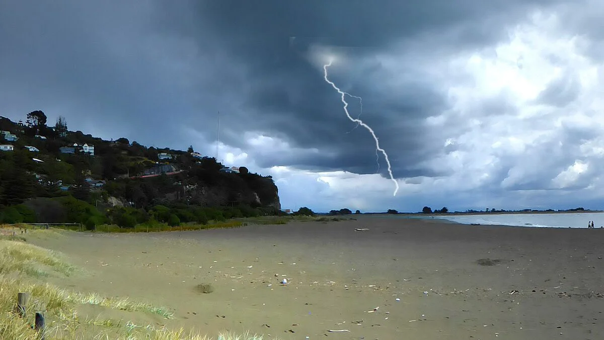 A lightning bolt over a beach.