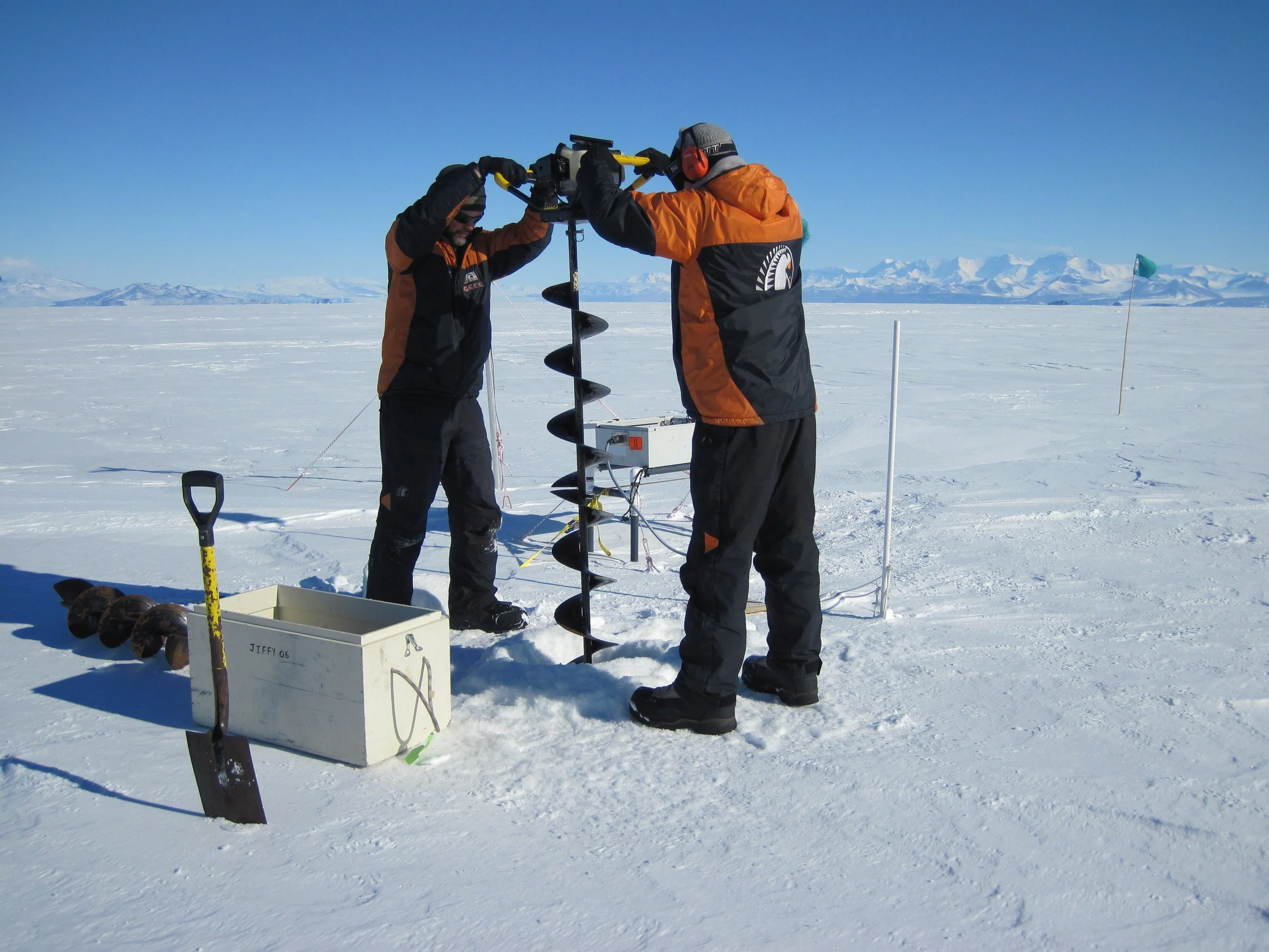 Scientists drilling into sea ice in Antarctica