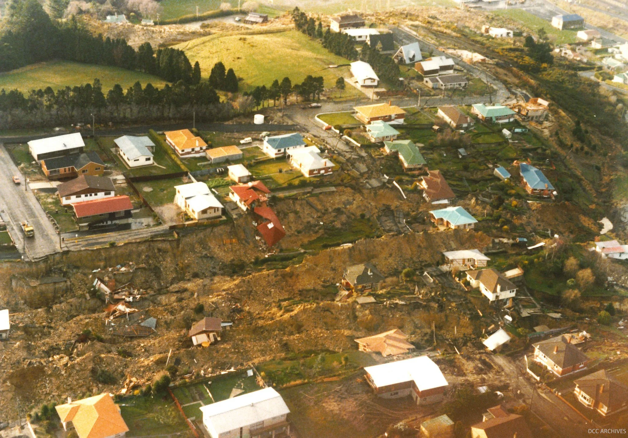 Aerial photo of homes destroyed by a landslide in Abbotsford, Dunedin.