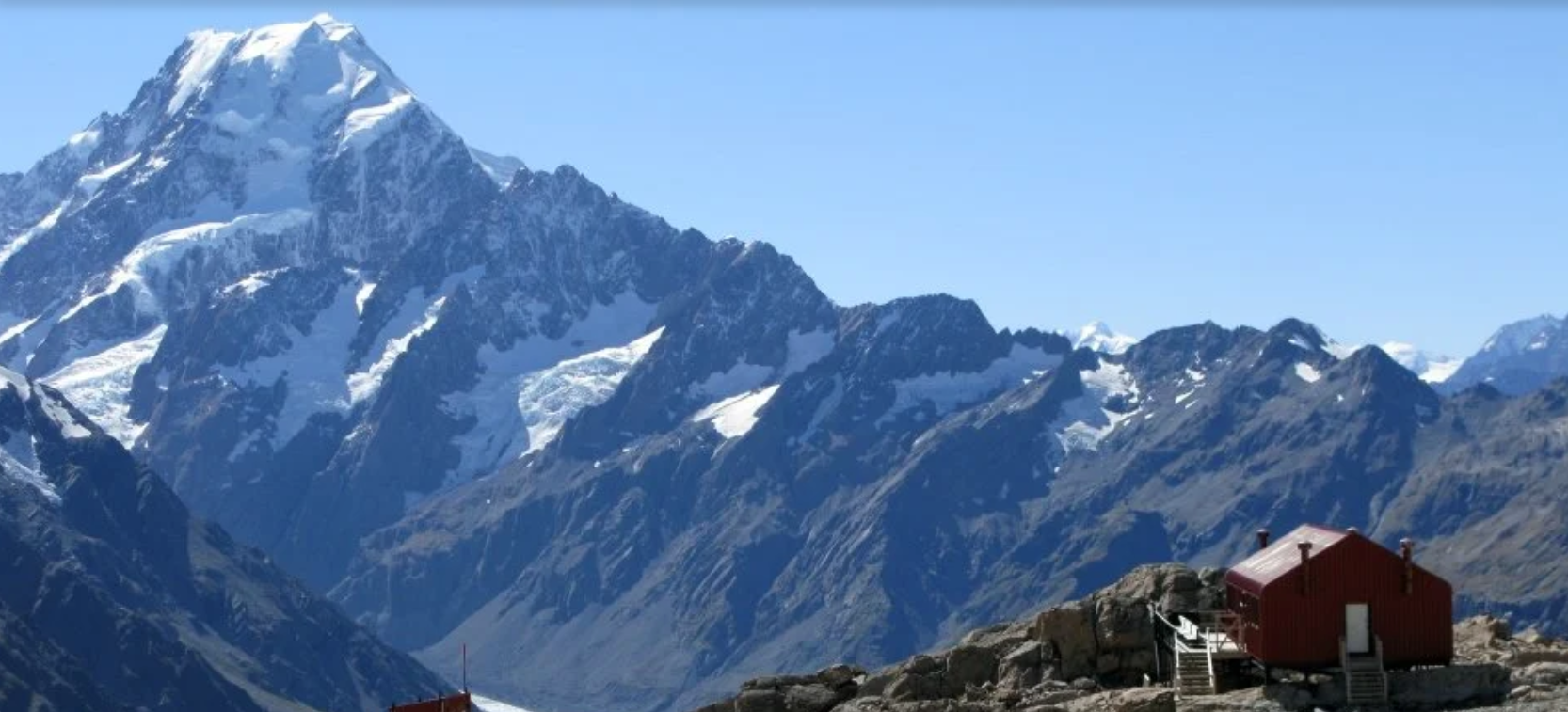 The peak of Aoraki | Mount Cook with a nearby hut.