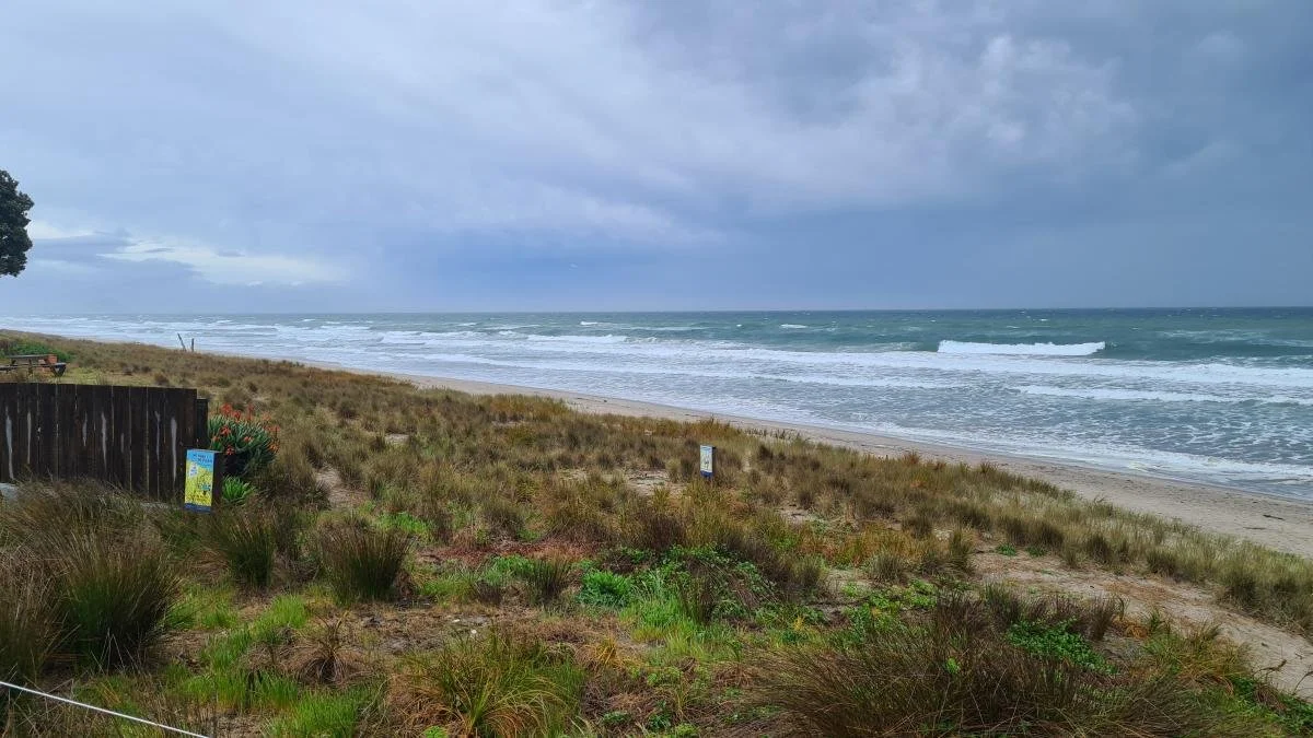 A beach with a brewing storm.