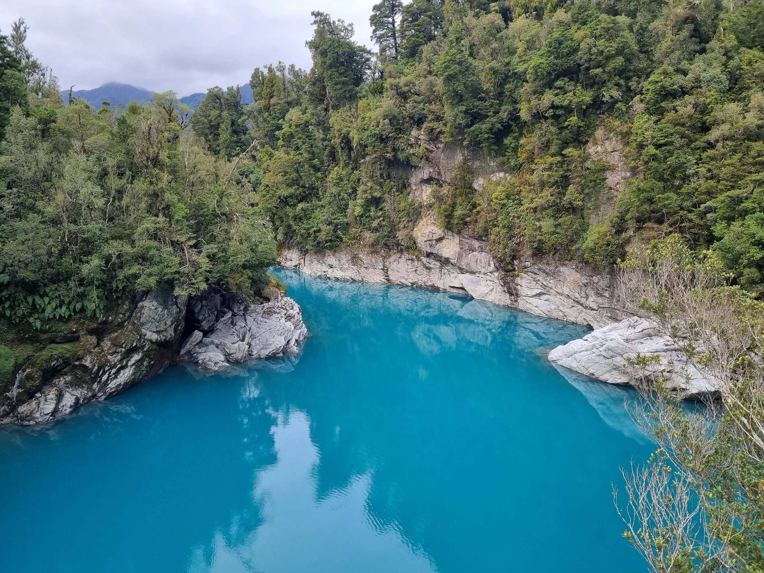 An image of the Hokitika River with its bright turquoise colour.