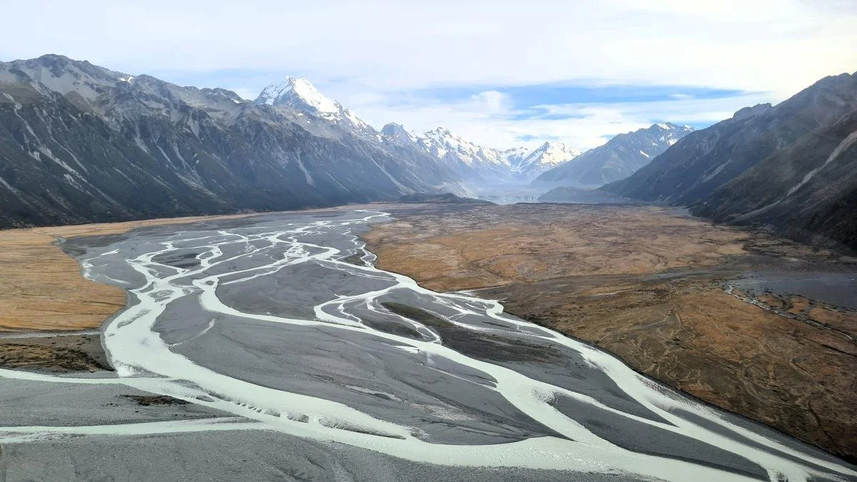Mountainous valley with river running through it.