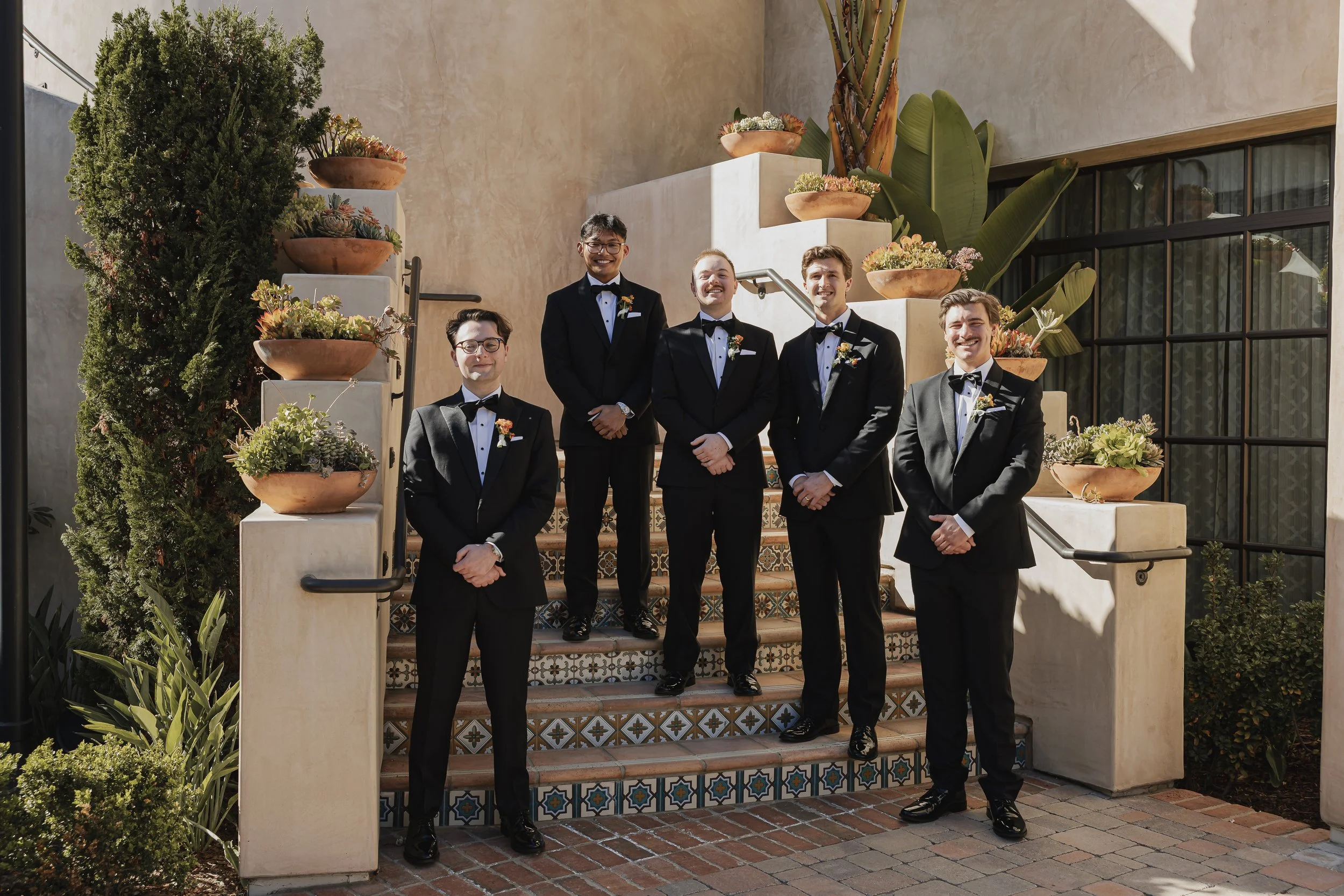 inn-at-the-mission-san-jaun-capistrano-autograph-collection-wedding-groomsmen-portrait.jpg
