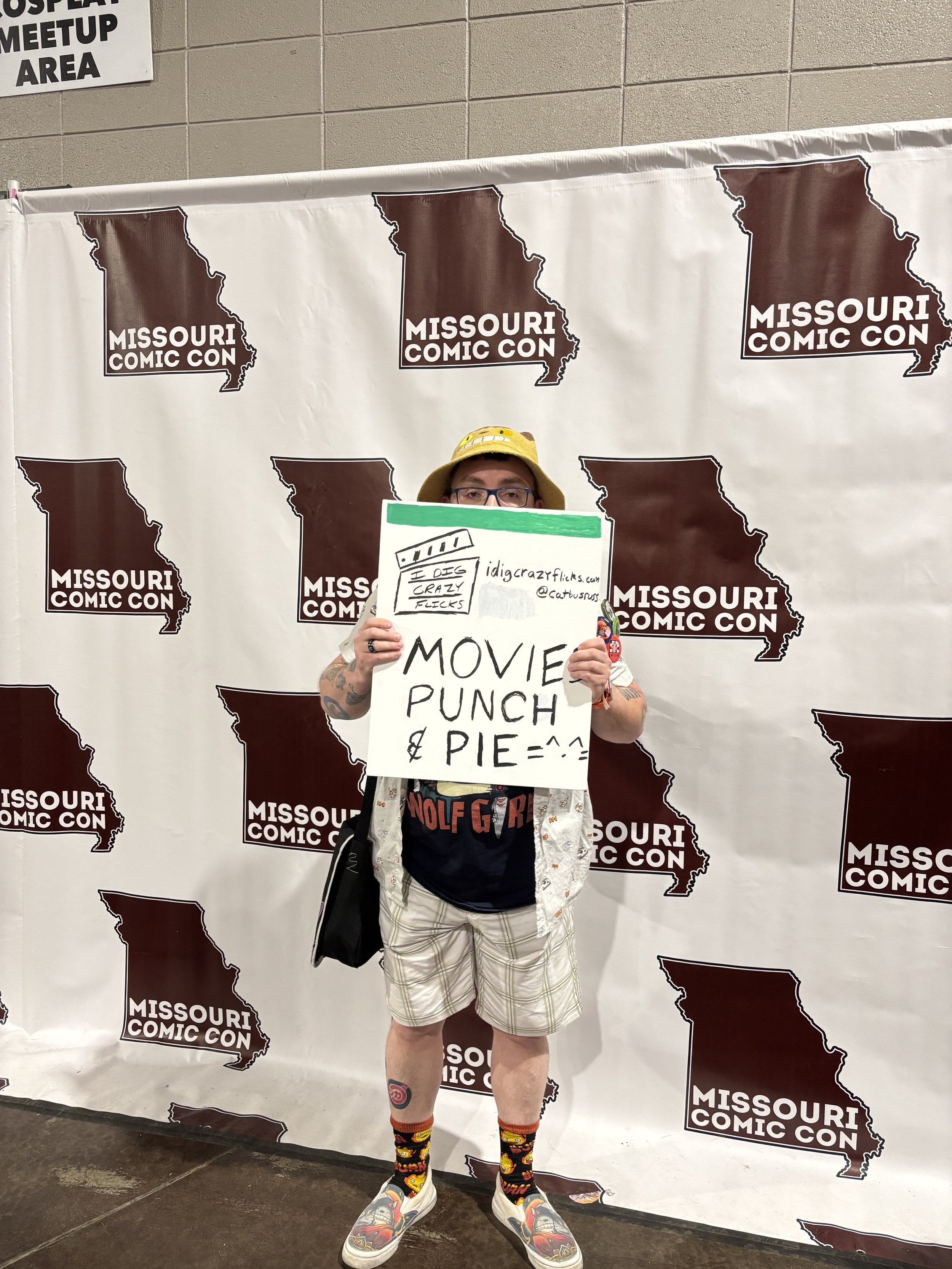 CatBusRuss with his movies, punch, and pie poster