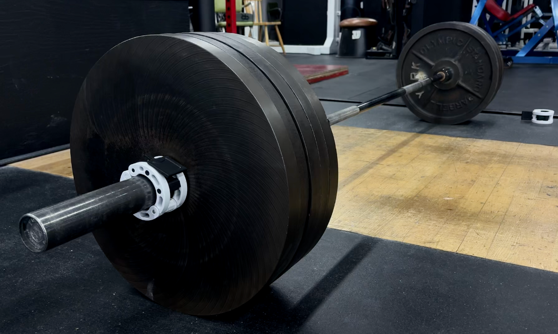 Loaded barbell on a deadlifting platform at Downing's Gym.