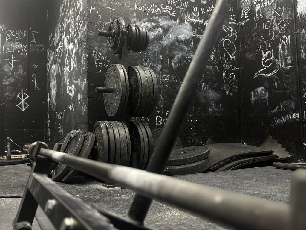 Deadlift platform and weight plates at Downing's Gym.