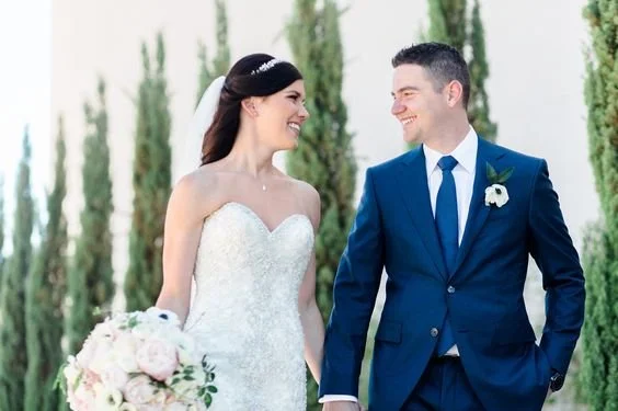 Groom in blue suit on wedding day