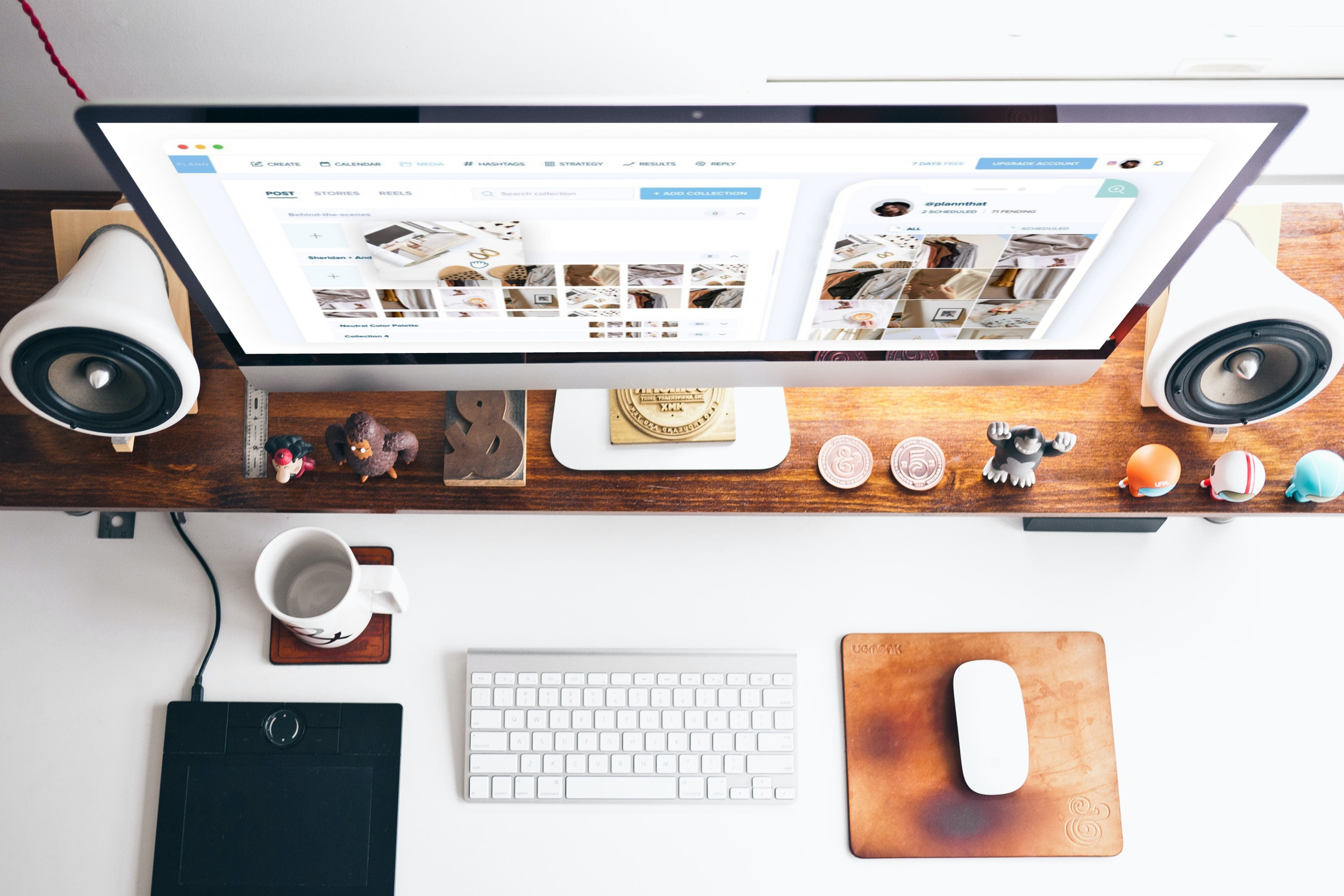 Overhead view of PlannThat.com content scheduler on a desktop computer.