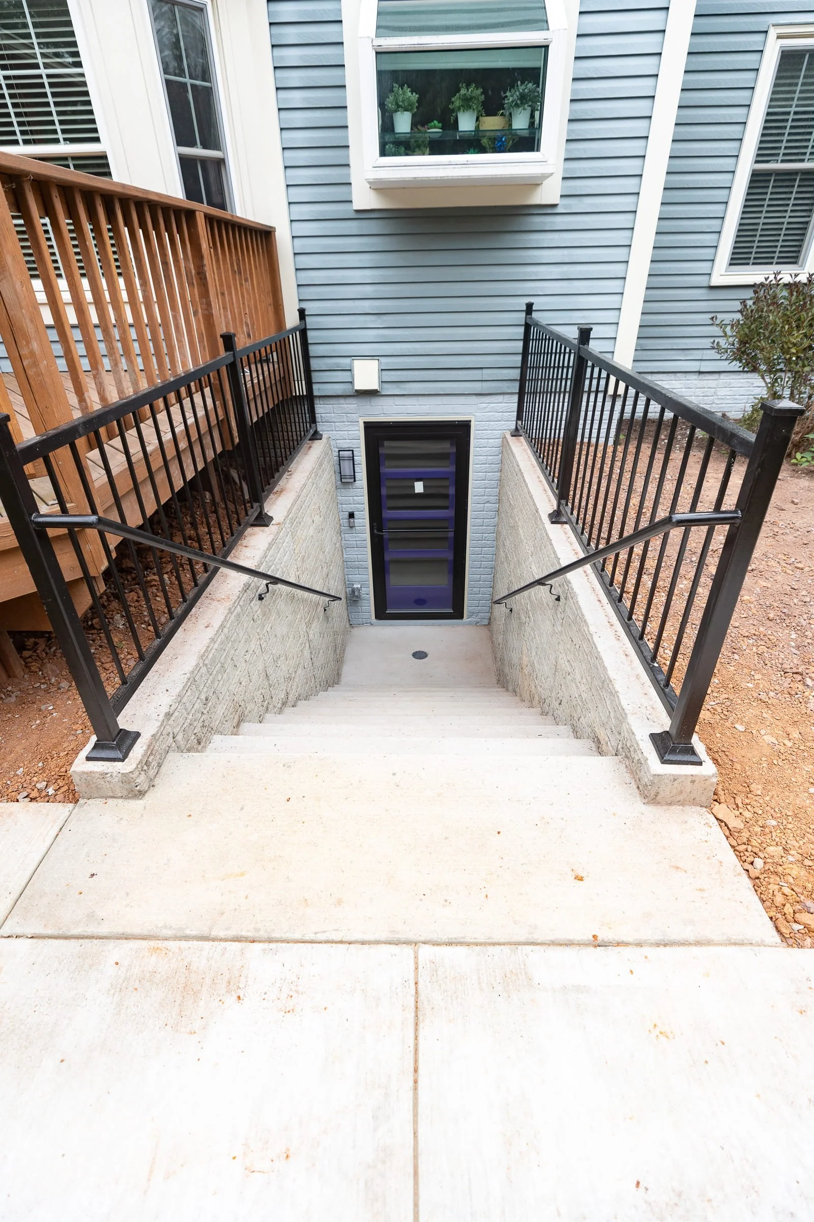 basement finishing Langley, basement renovation contractor Langley, basement finishing Silverthistle Ct, basement kitchenette remodel, Fabuwood Galaxy Mocha basement cabinets, basement walkout entrance addition, Studio Tifton luxury vinyl plank basem
