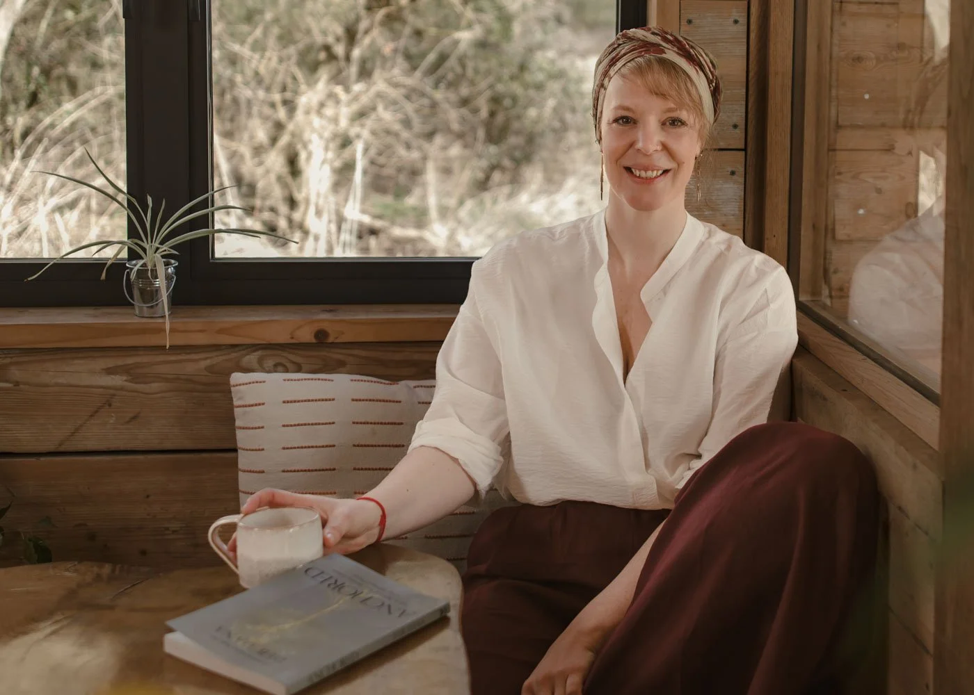 Erika Chalkley smiling — embodiment coach and mentor for ambitious women building sustainable businesses