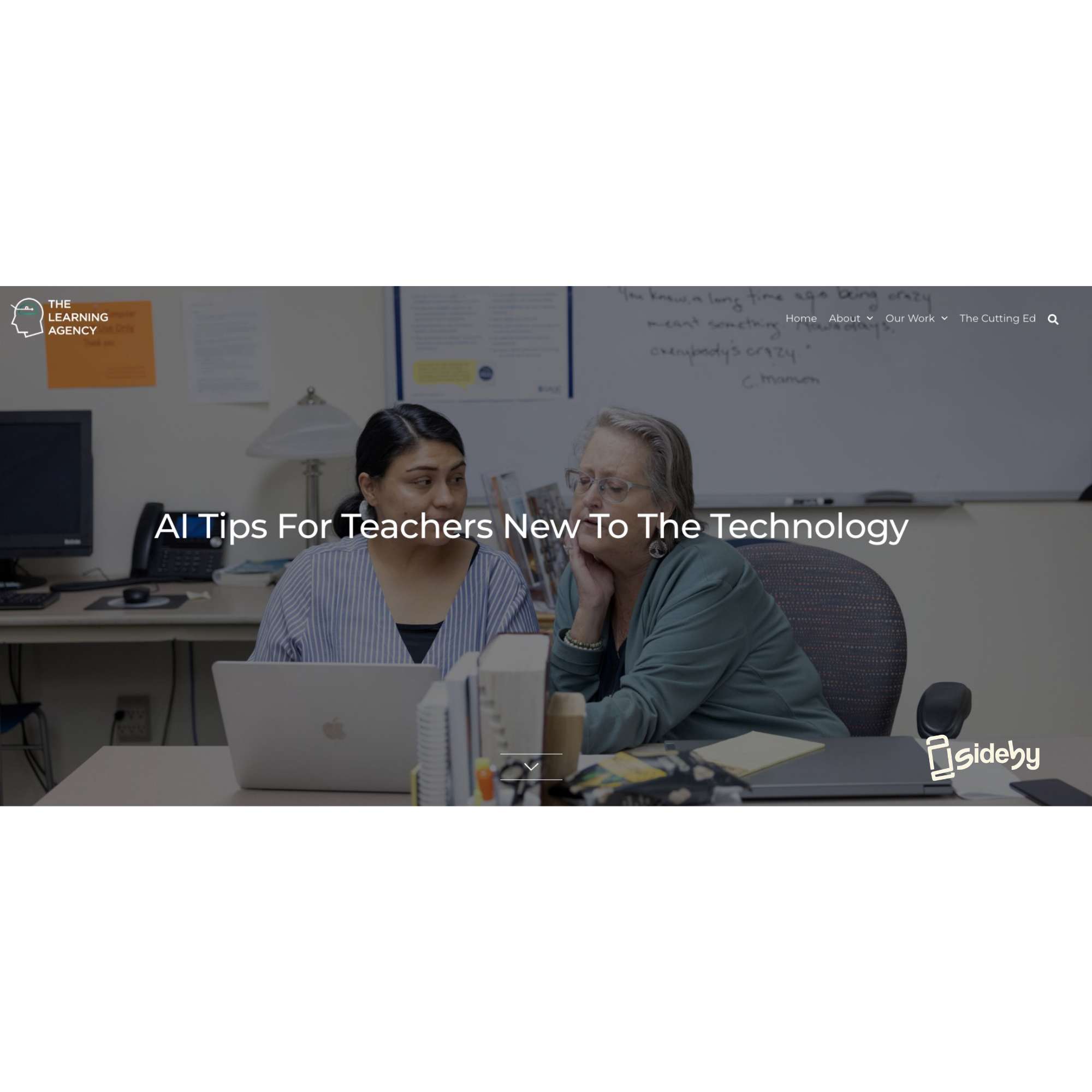 two people work on a computer at a desk