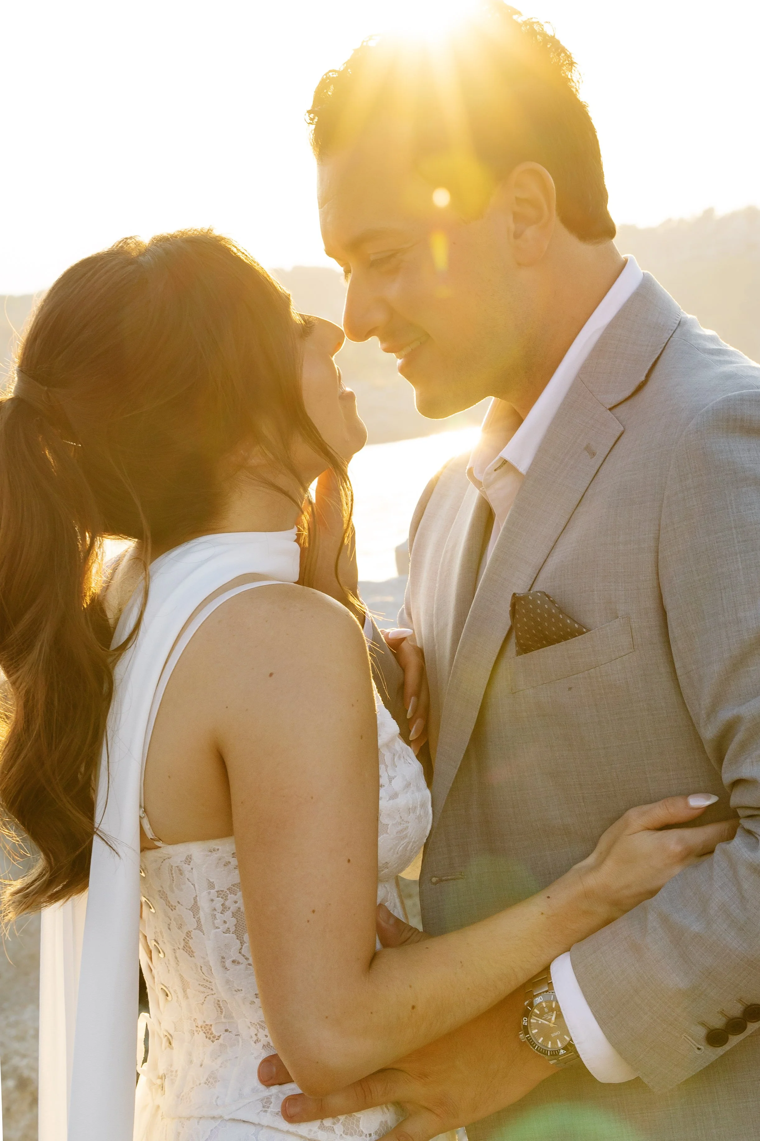 New England, Dreamy, romantic golden hour wedding portraits. Close up reaction of couple staring into each others eyes.