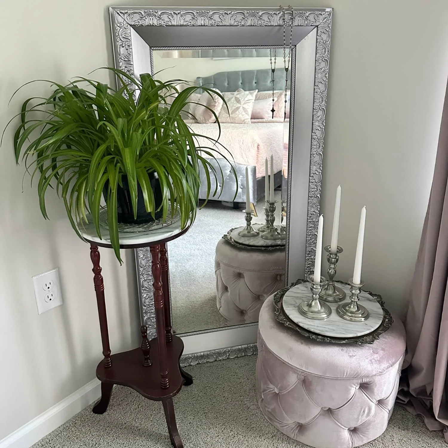 Collection of secondhand vintage items including an ornate mirror, plant stand, silver-plated tray, marble piece, and pewter candlesticks—showcasing how easy it is to find antique treasures everywhere.
