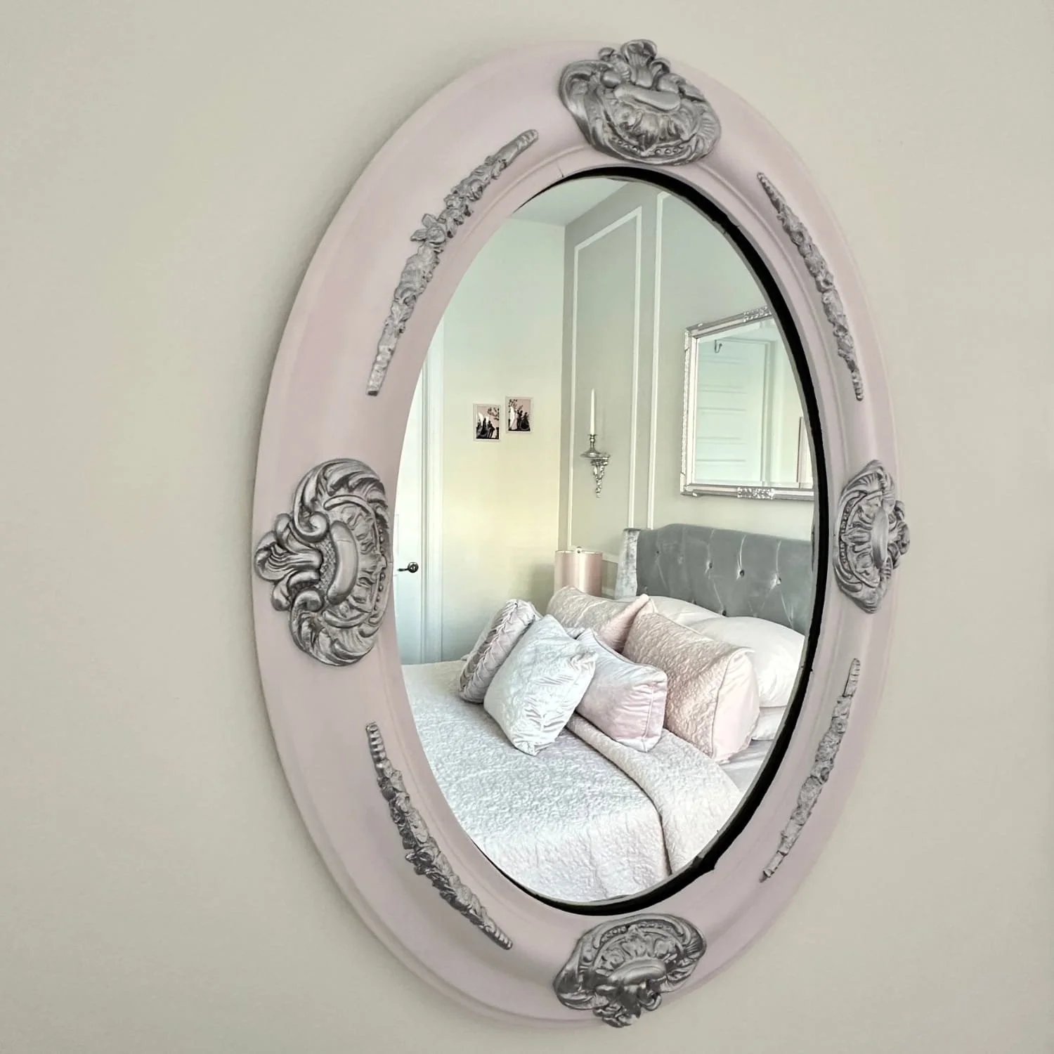 Antique frame upcycled into a mirror, purchased from Goodwill for $7.99 and customized with a touch of paint—showing how secondhand pieces invite guilt-free creativity.