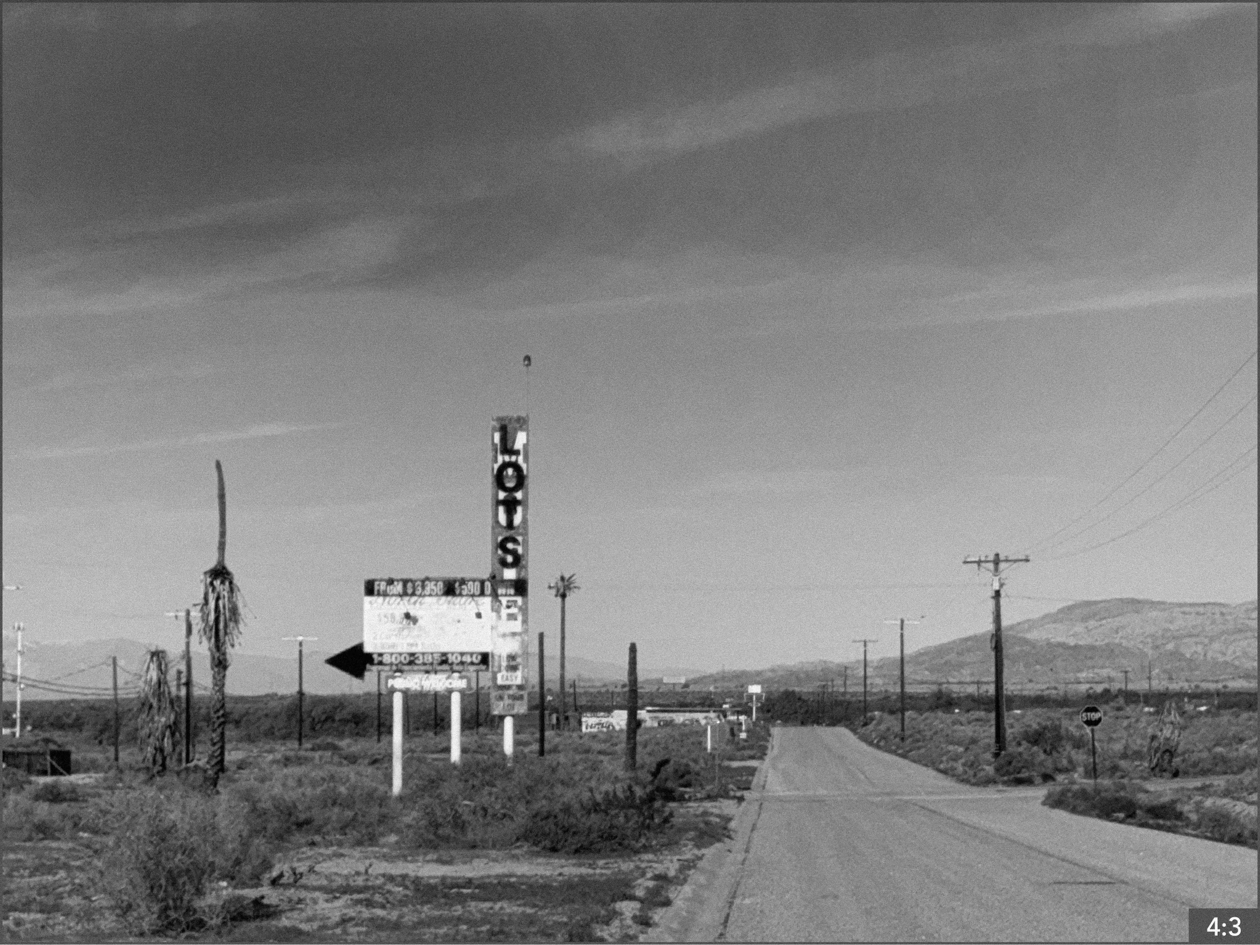 7. Salton Sea North Beach 11:30 am route 111 98900 block near fire station  6. LONG SHOT: father and daughter stand in the middle of the street looking at one another. *Option-1. SHOT LONG MEDIUM CLOSE: father stands or crouches in the middle of the 