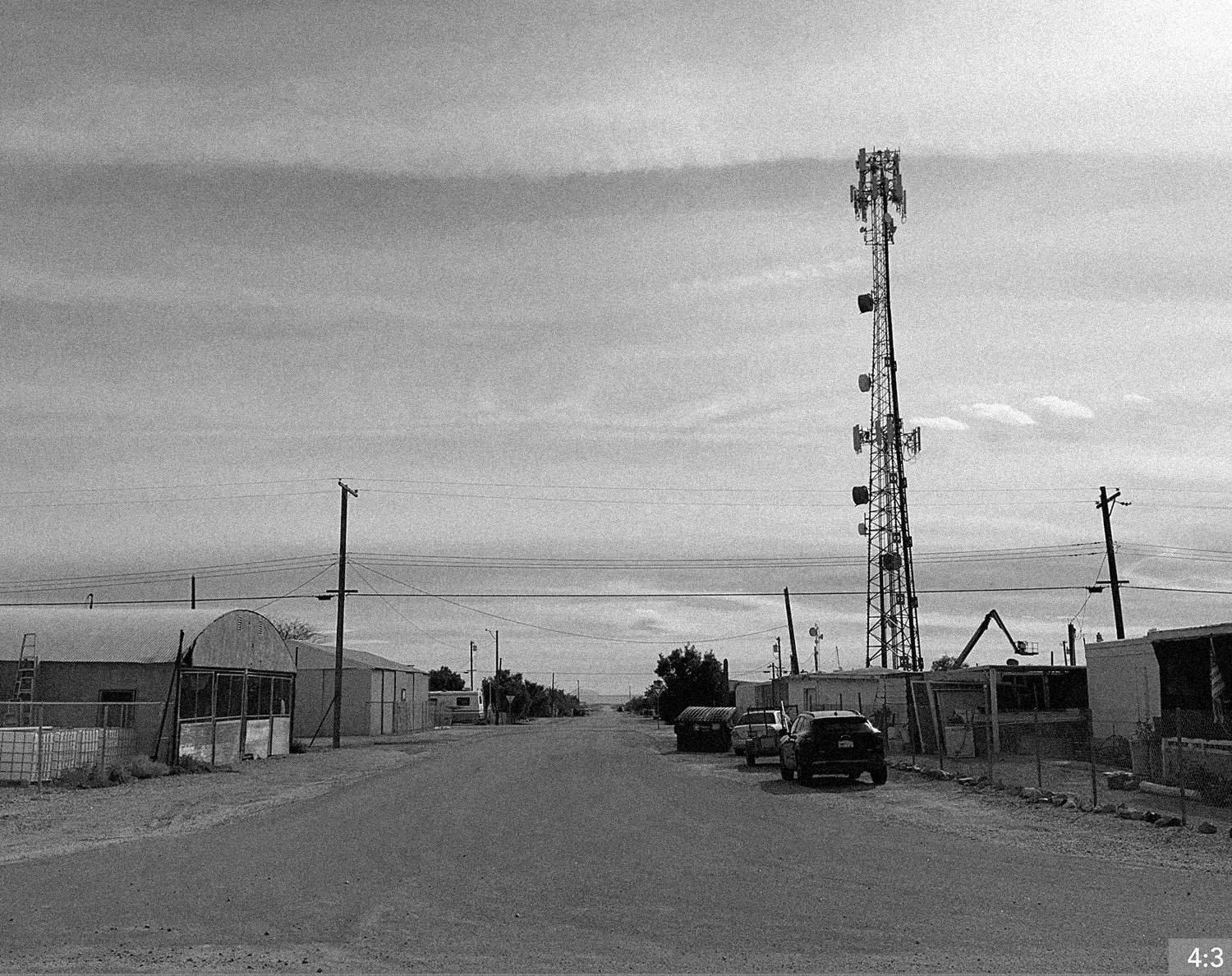 61. Salton Sea 7. LONG SHOT: Father and daughter dance together in the middle of the street.  *EXTRA SHOT GIRL SKIPS/RUNS CAMERA TRACKING FROM BACK OF VEHICLE.