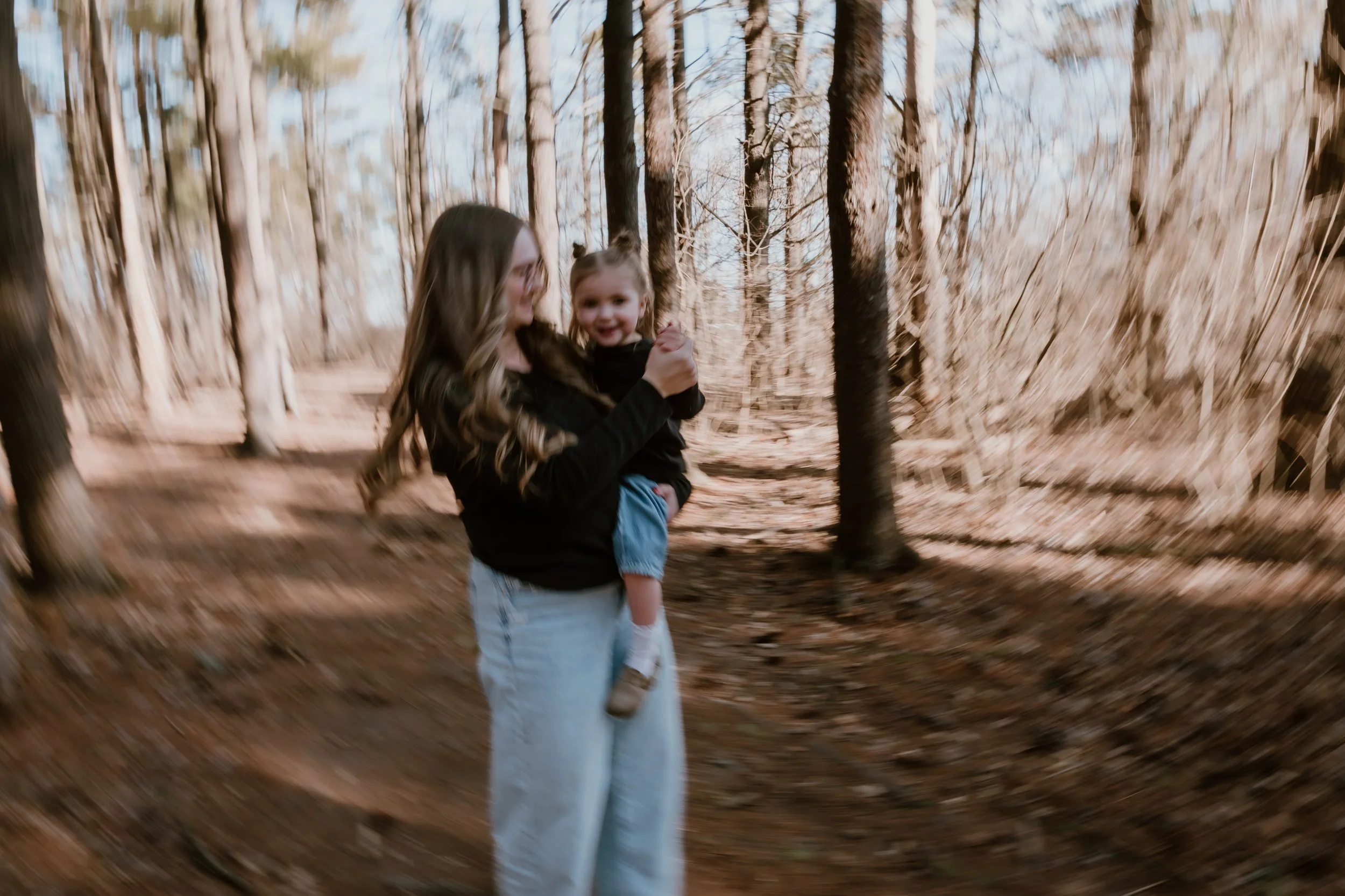 Candid family photo showing genuine connection during a lifestyle family session near Peoria IL, ideal for parents who value consistency in their photographer.