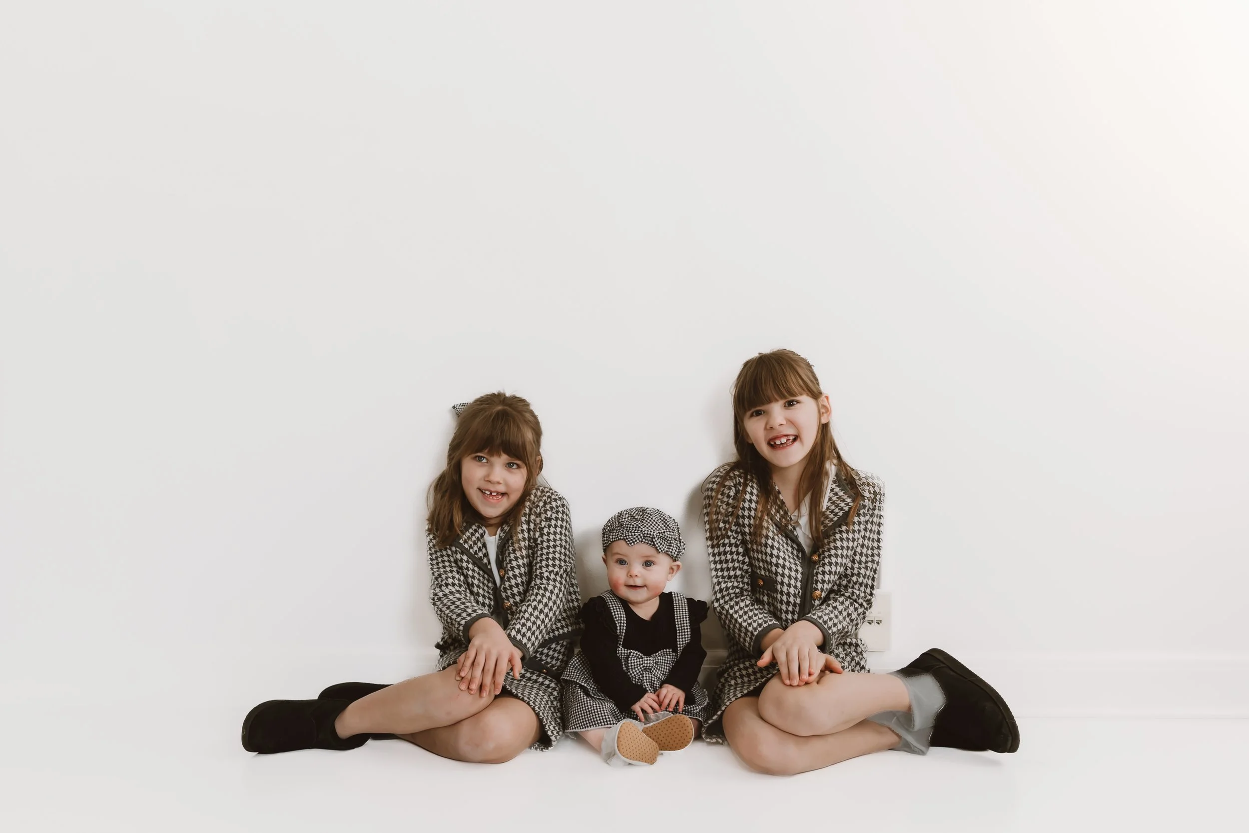 Studio Family Photos in Peoria, Illinois: Why Simple Backgrounds Make the Most Timeless Images