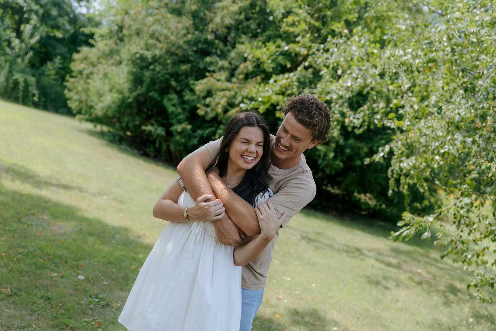 Couple laughing together during outdoor couples photos in Peoria Illinois