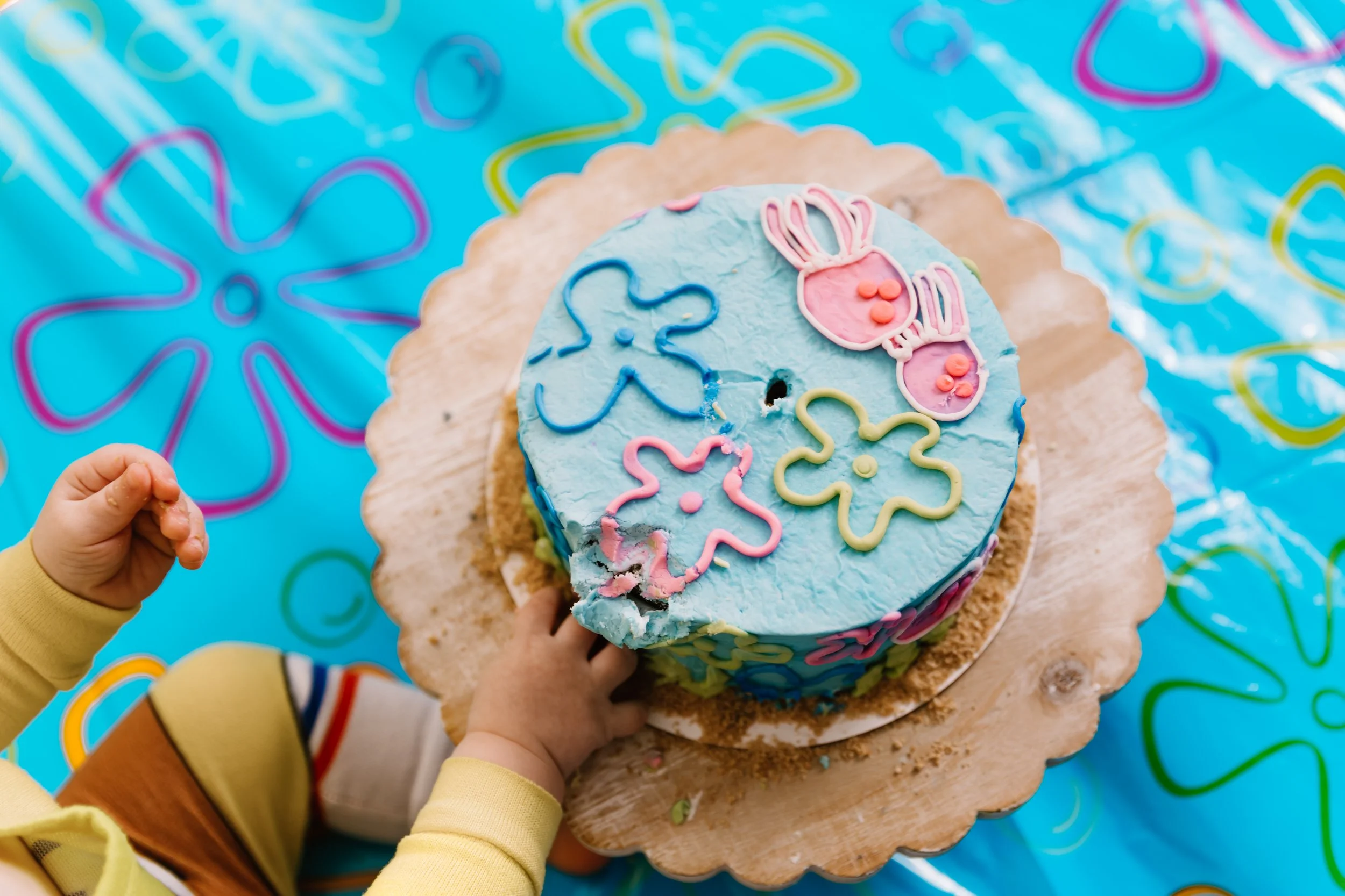 Close-up of blue SpongeBob themed birthday cake with number one candle