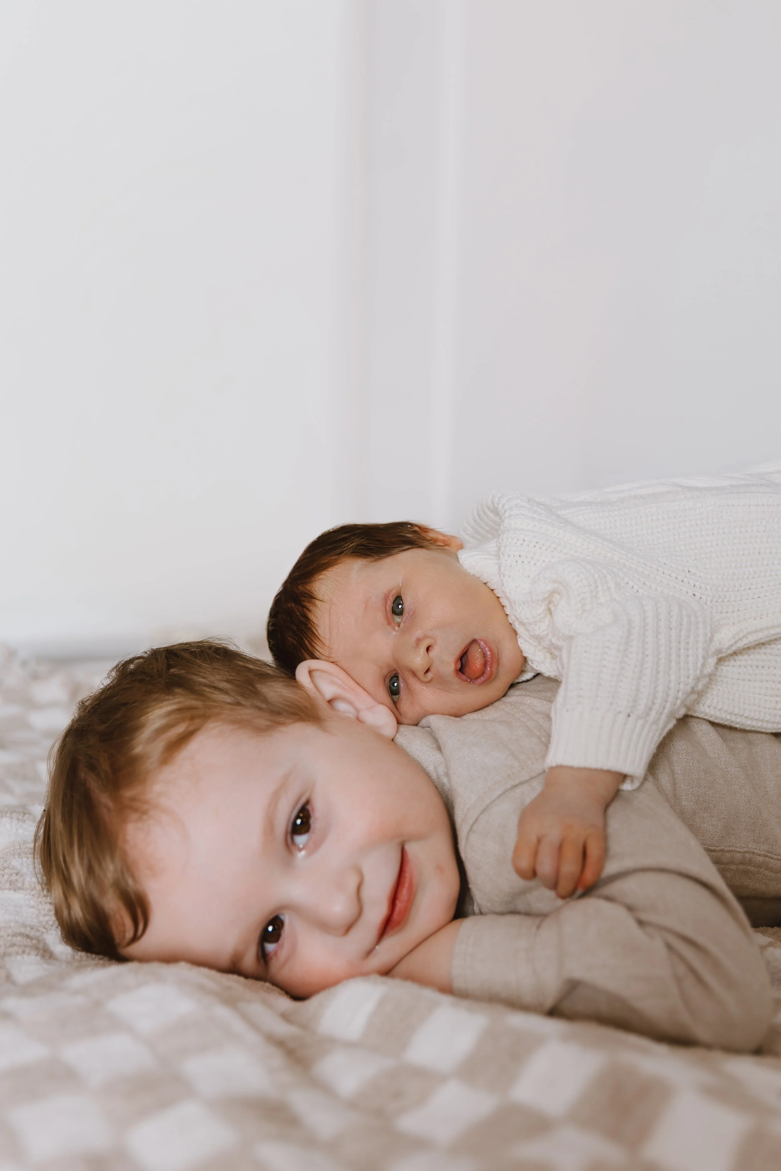 sibling newborn portrait toddler and baby