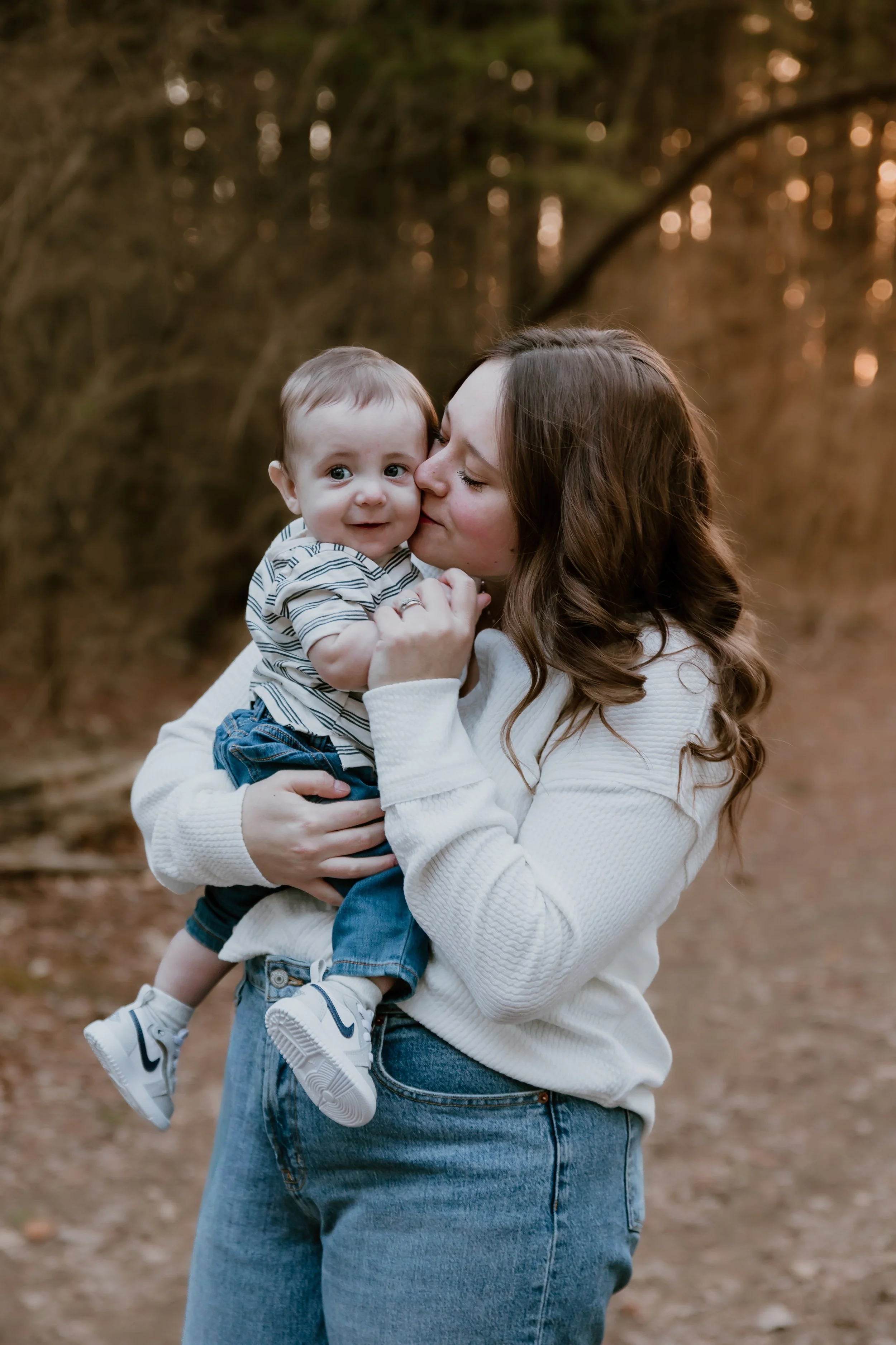 Central Illinois photograph of mother kissing her baby on cheek