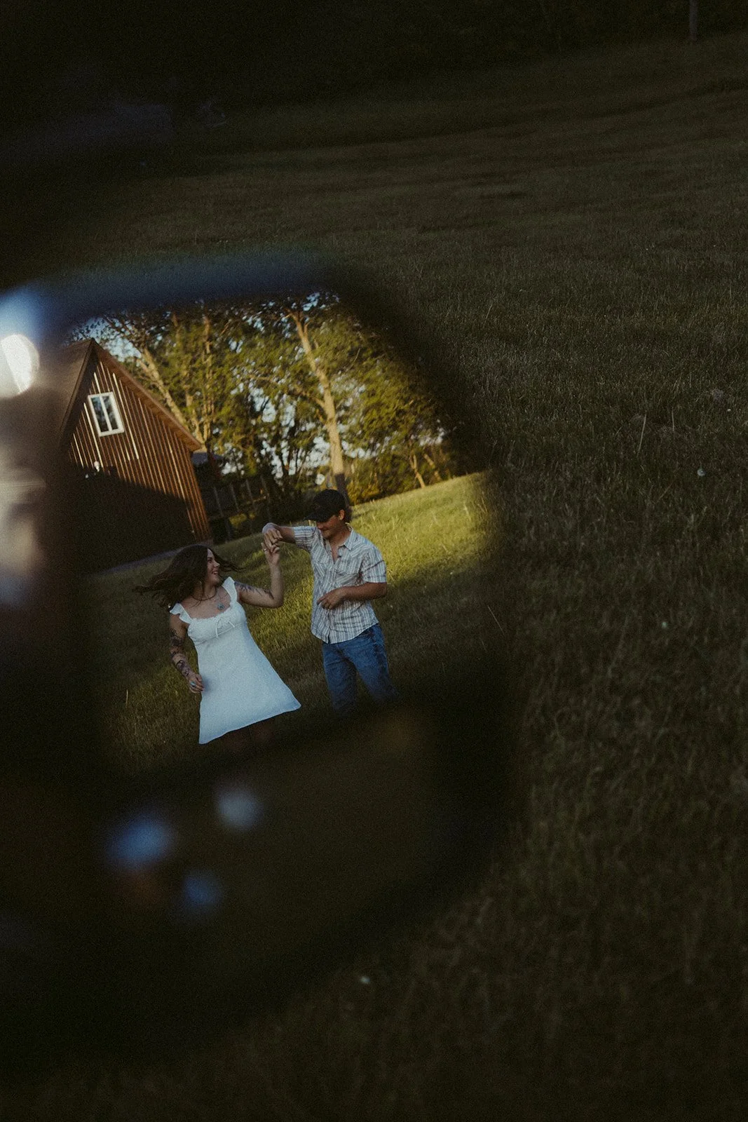 Couple talking through truck window during candid couples photography session