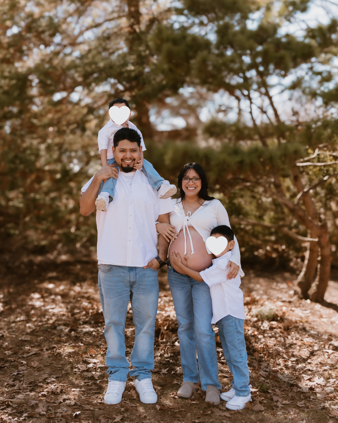 family maternity portrait under trees